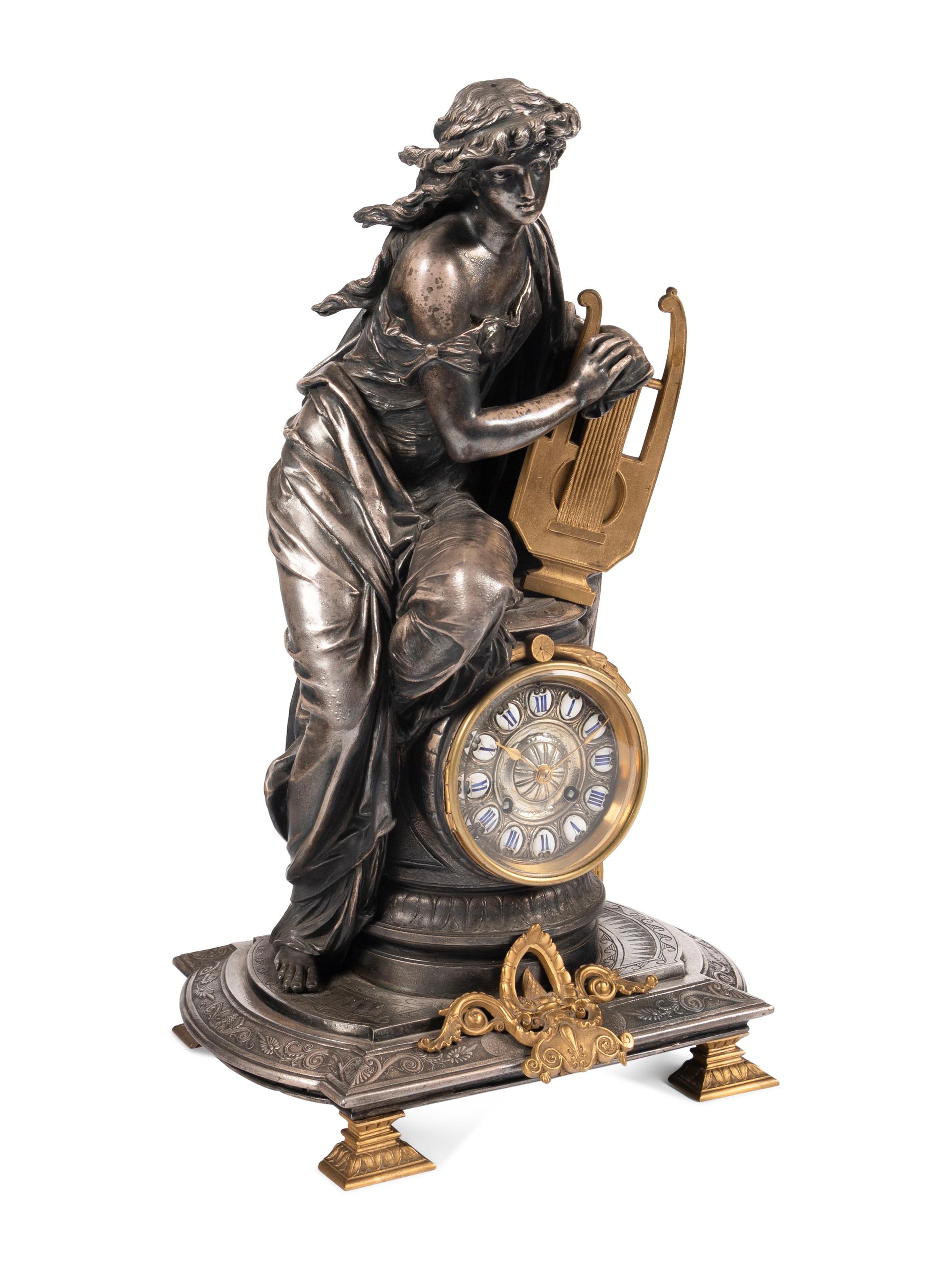 A French Gilt Bronze and Cast Metal Figural Clock