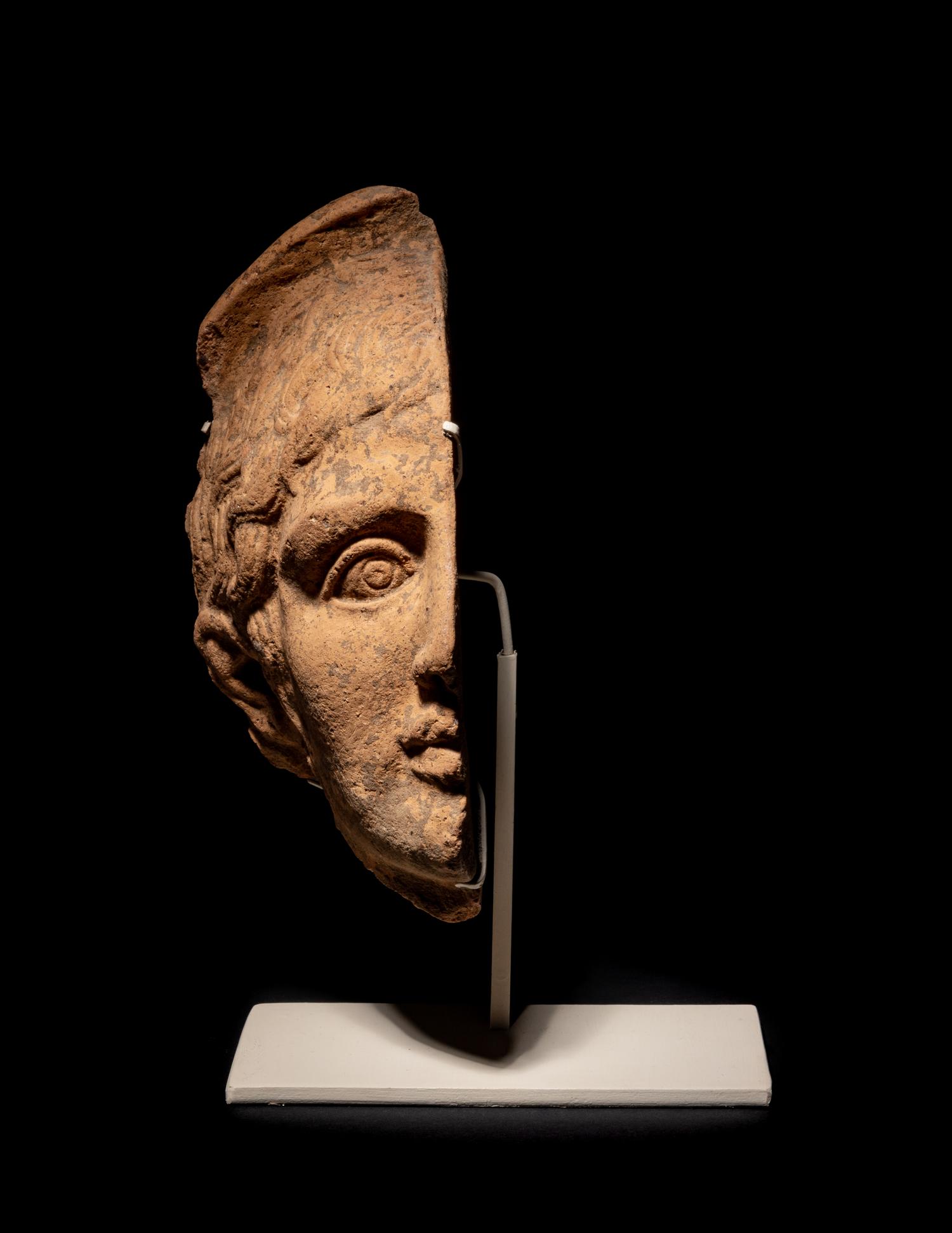 An Etruscan Terra Cotta Votive Half Head