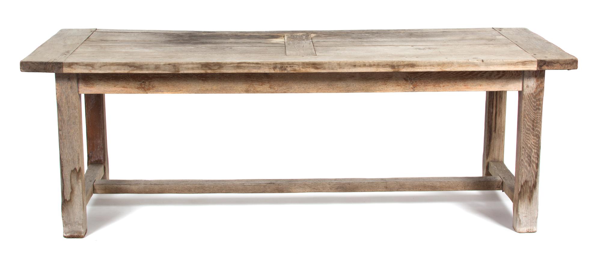 A Weathered Teak Dining Table Height 29 1/2 x length 86 1/2 x width 33 1/2 inches. — 20TH CENTURY