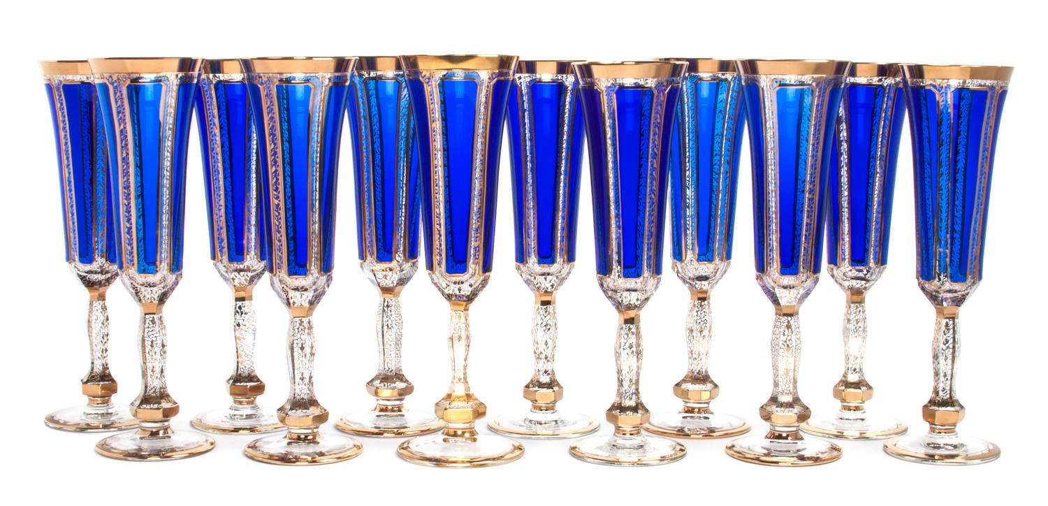 A Set of Twelve Parcel Gilt Cobalt and Clear Glass Champagne Flutes Height 9 inches.