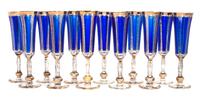 A Set of Twelve Parcel Gilt Cobalt and Clear Glass Champagne Flutes Height 9 inches.