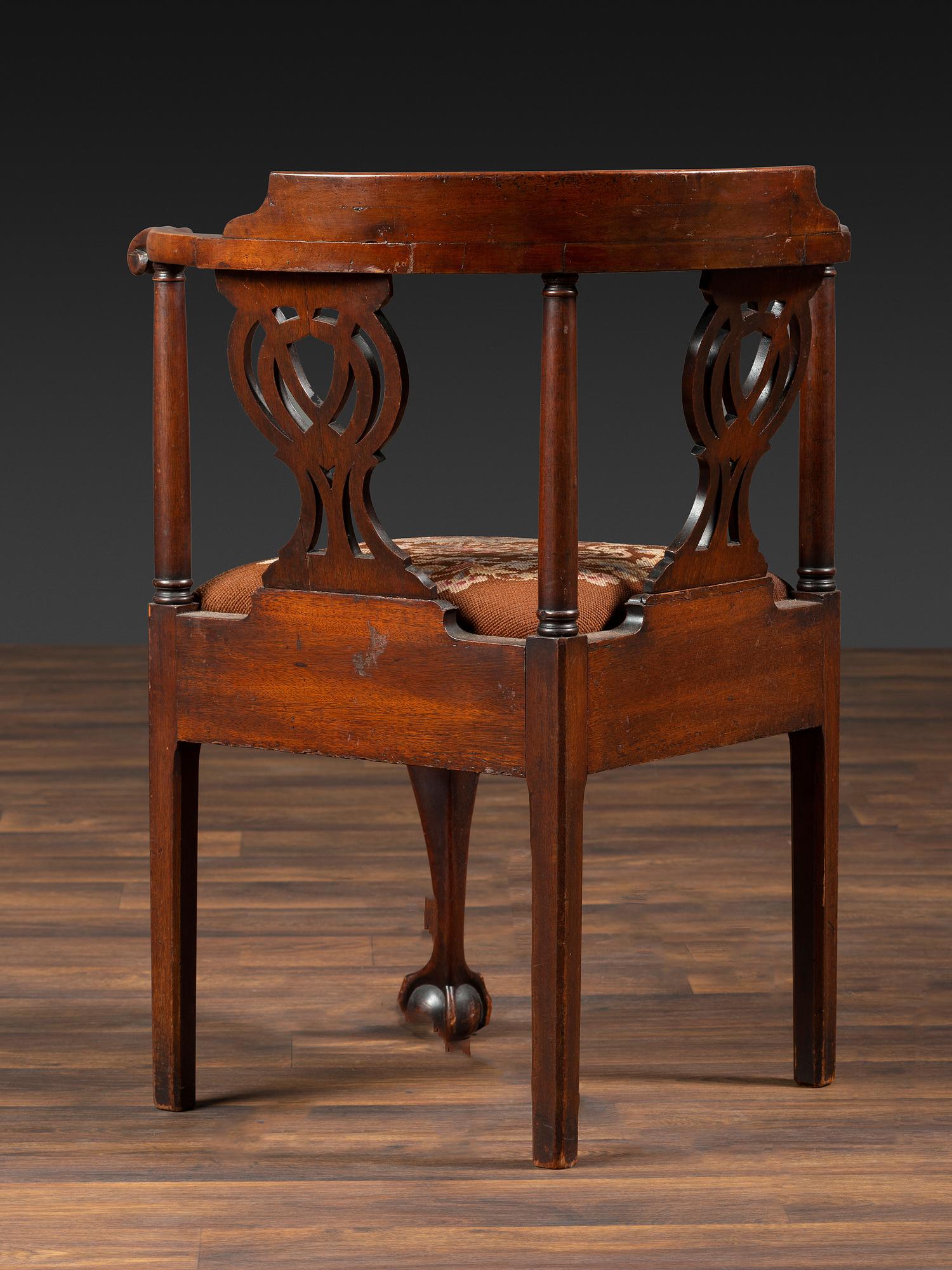 A Chippendale Shell-Carved Mahogany Knuckle-Arm Claw-and-Ball Foot Corner Chair