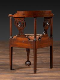 A Chippendale Shell-Carved Mahogany Knuckle-Arm Claw-and-Ball Foot Corner Chair