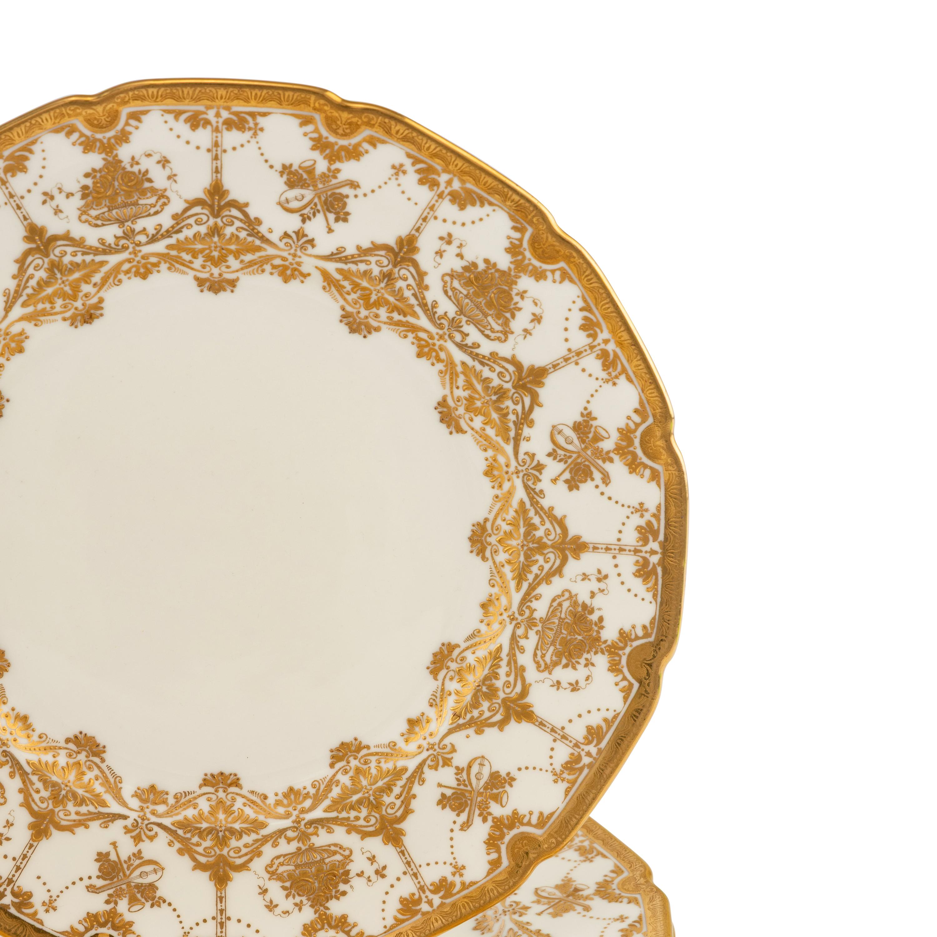A Set of Ten Royal Doulton Gilt Decorated Porcelain Service Plates