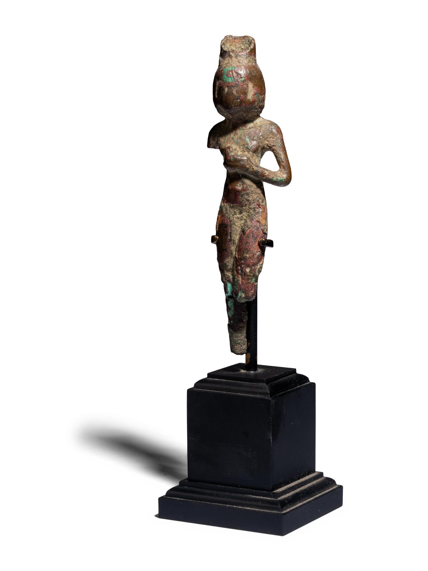 An Egyptian Bronze Concubine Holding a Duck