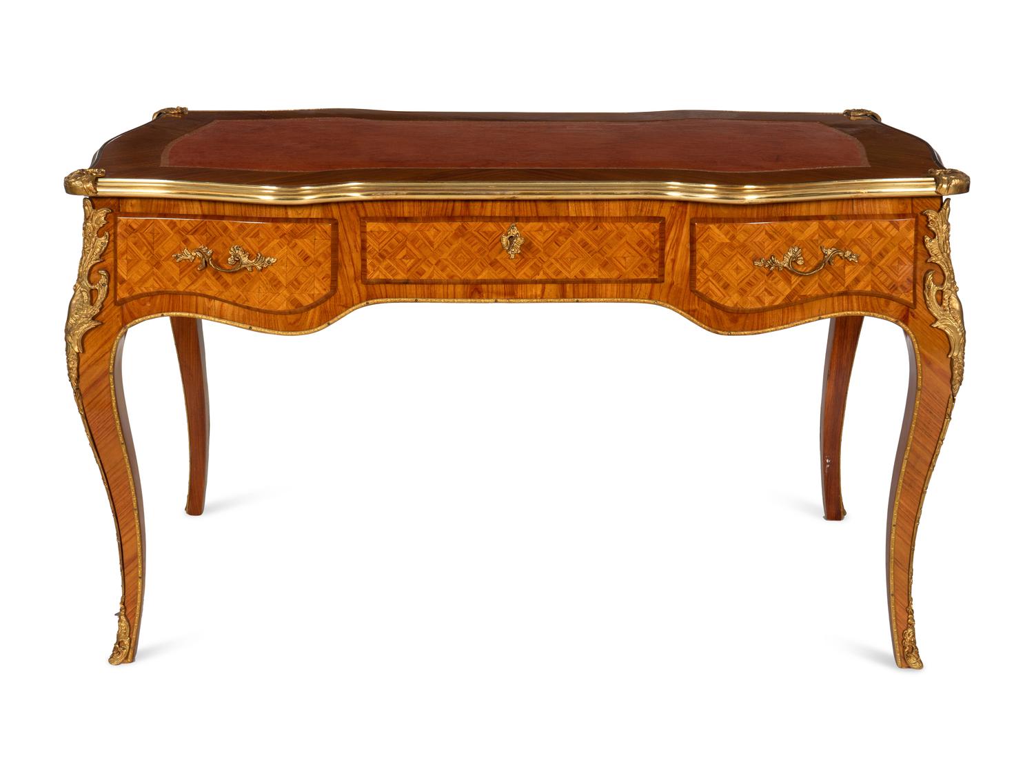 A Louis XV Style Gilt Bronze Mounted Parquetry Bureau Plat and Regency Style Parcel Gilt Chair