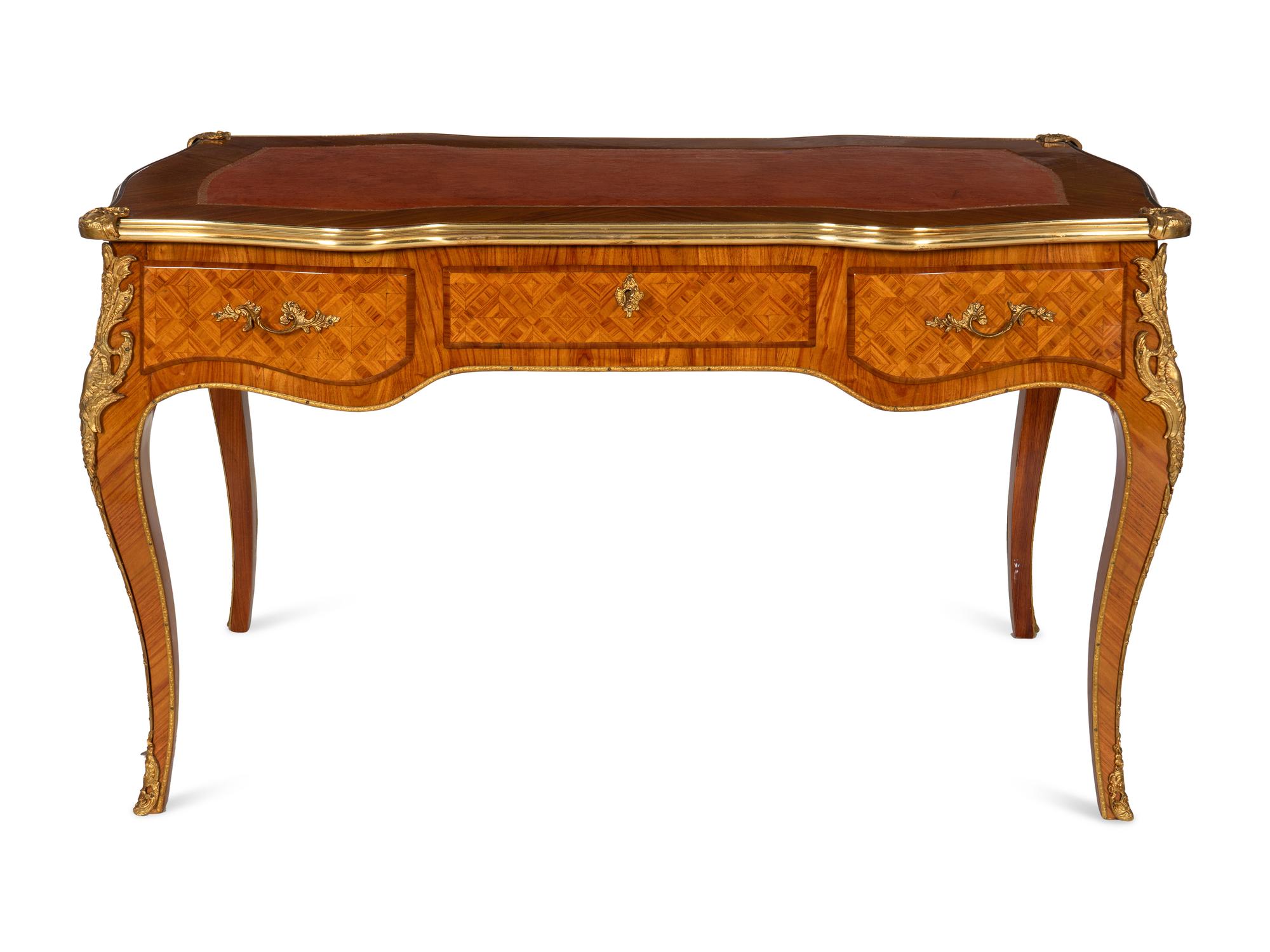 A Louis XV Style Gilt Bronze Mounted Parquetry Bureau Plat and Regency Style Parcel Gilt Chair