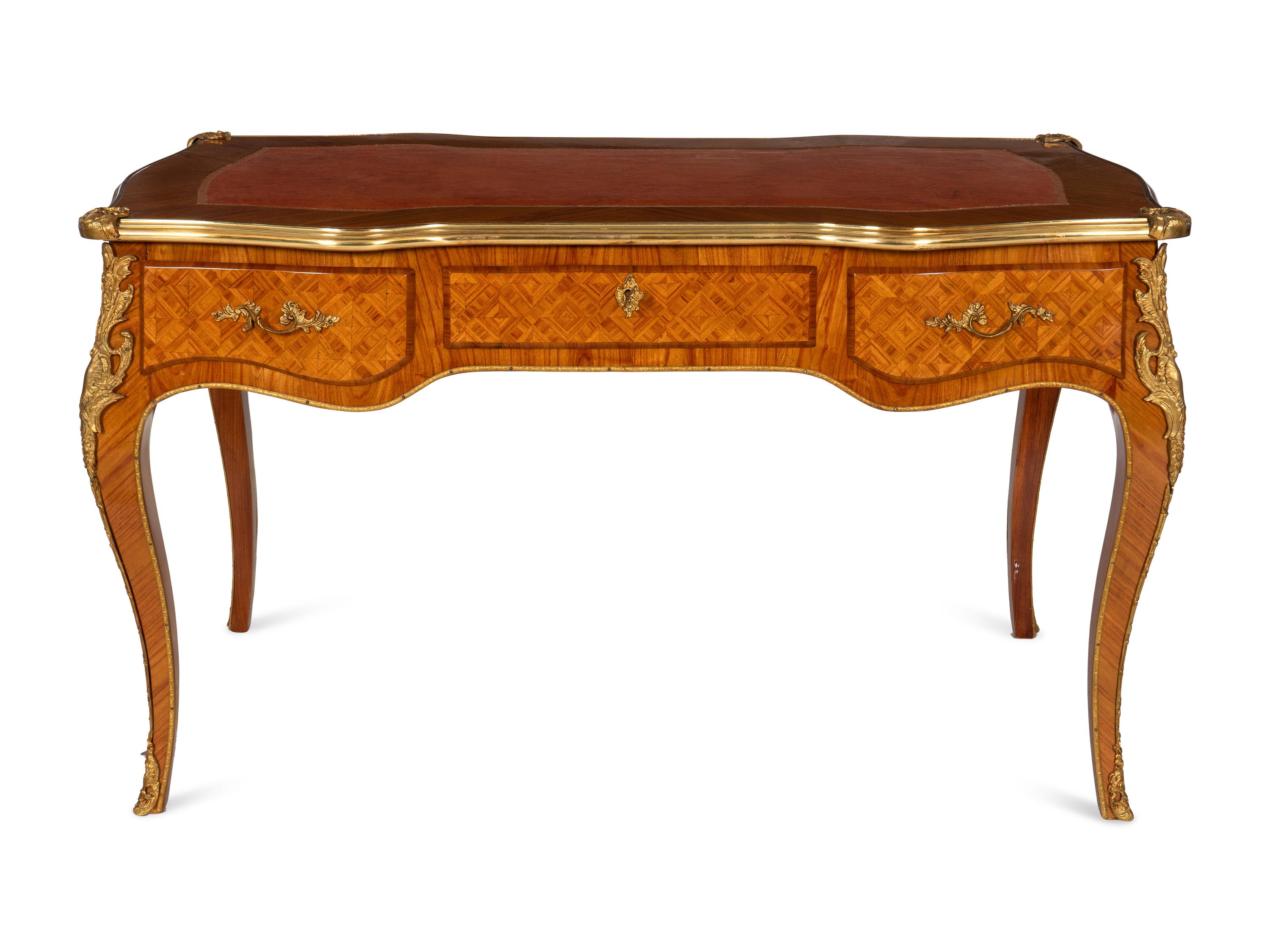 A Louis XV Style Gilt Bronze Mounted Parquetry Bureau Plat and Regency Style Parcel Gilt Chair