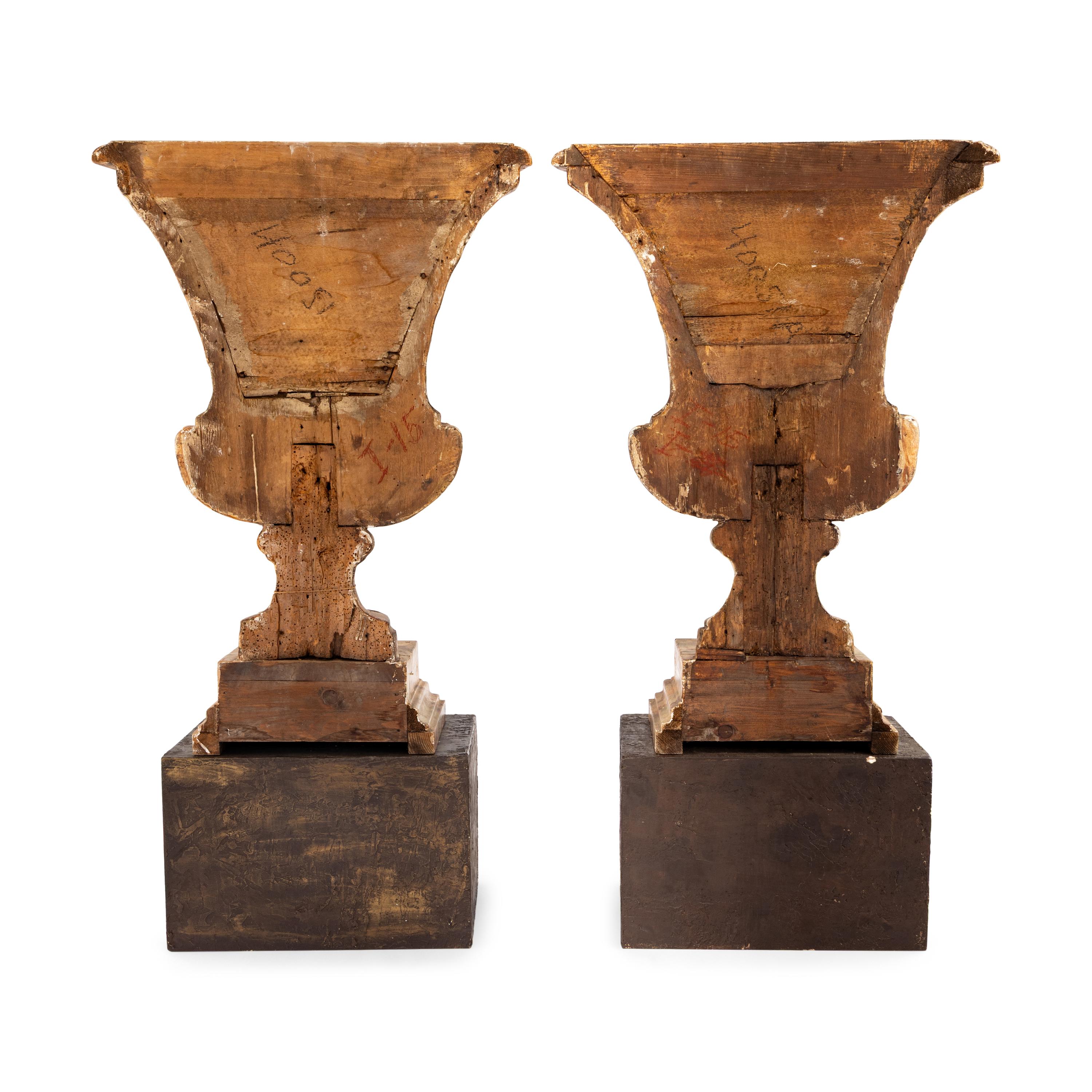 A Pair of Italian Giltwood Flat-Back Urns
