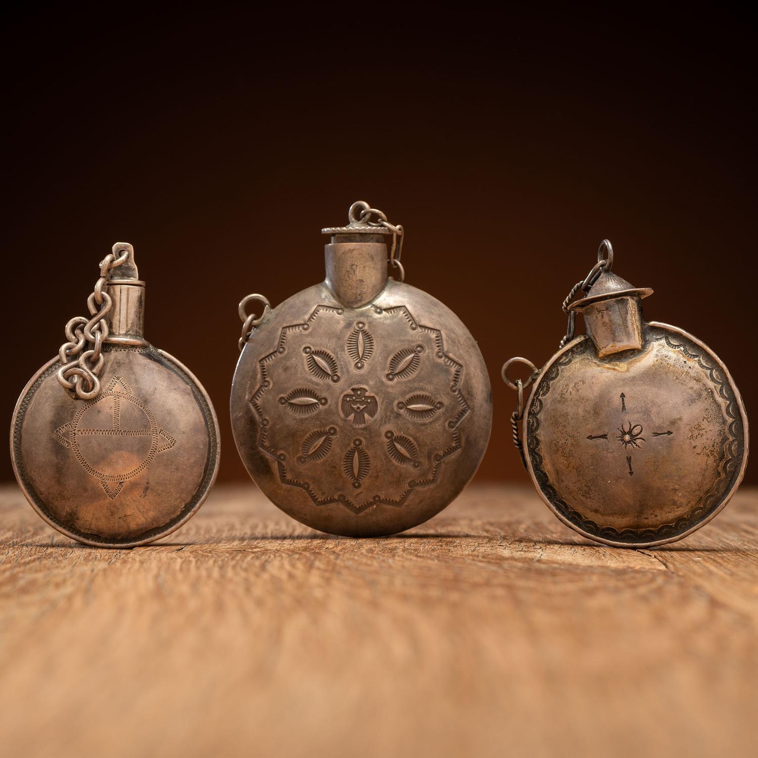 Navajo Stamped Silver Tobacco Canteens, with Thunderbird Designs