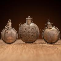 Navajo Stamped Silver Tobacco Canteens, with Thunderbird Designs