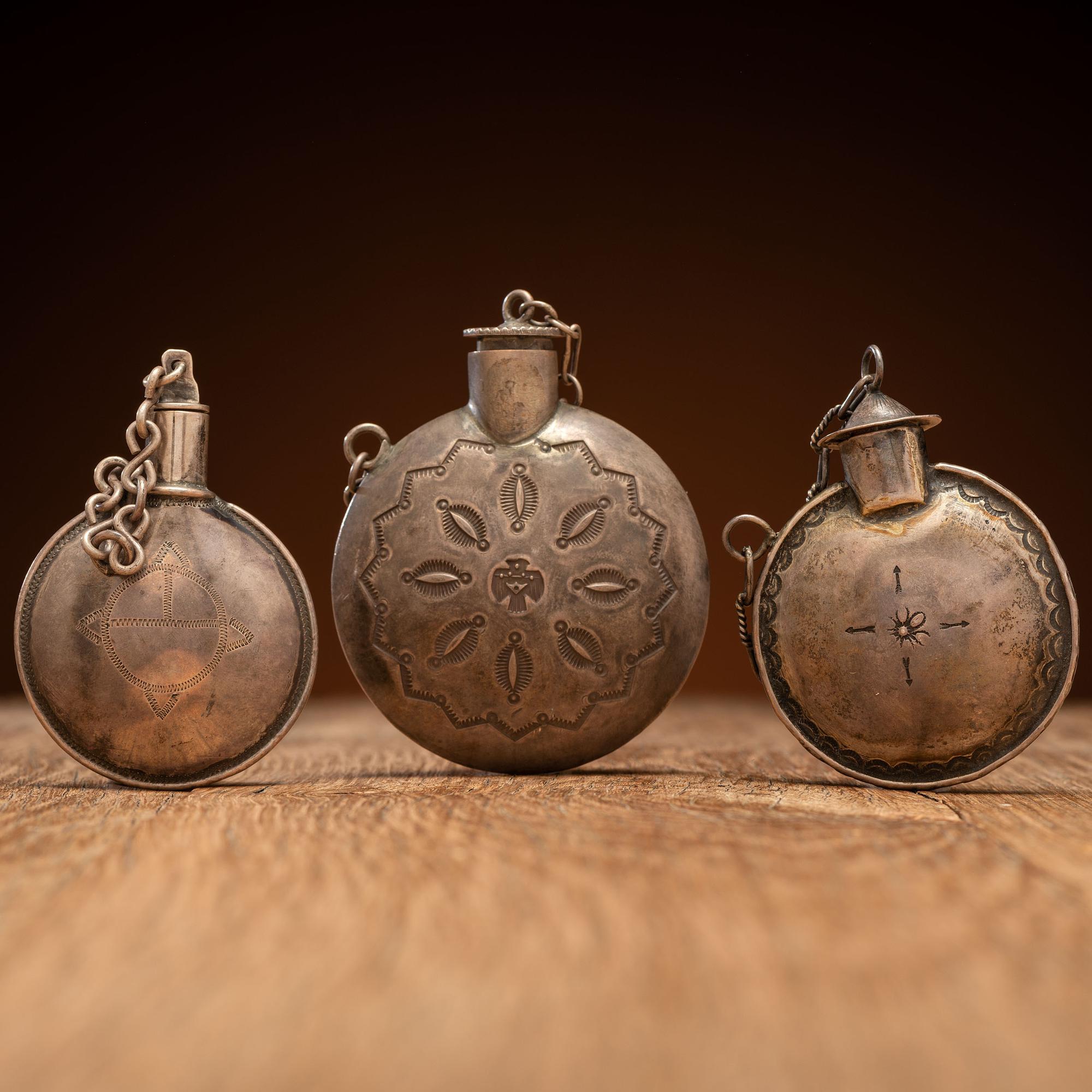 Navajo Stamped Silver Tobacco Canteens, with Thunderbird Designs