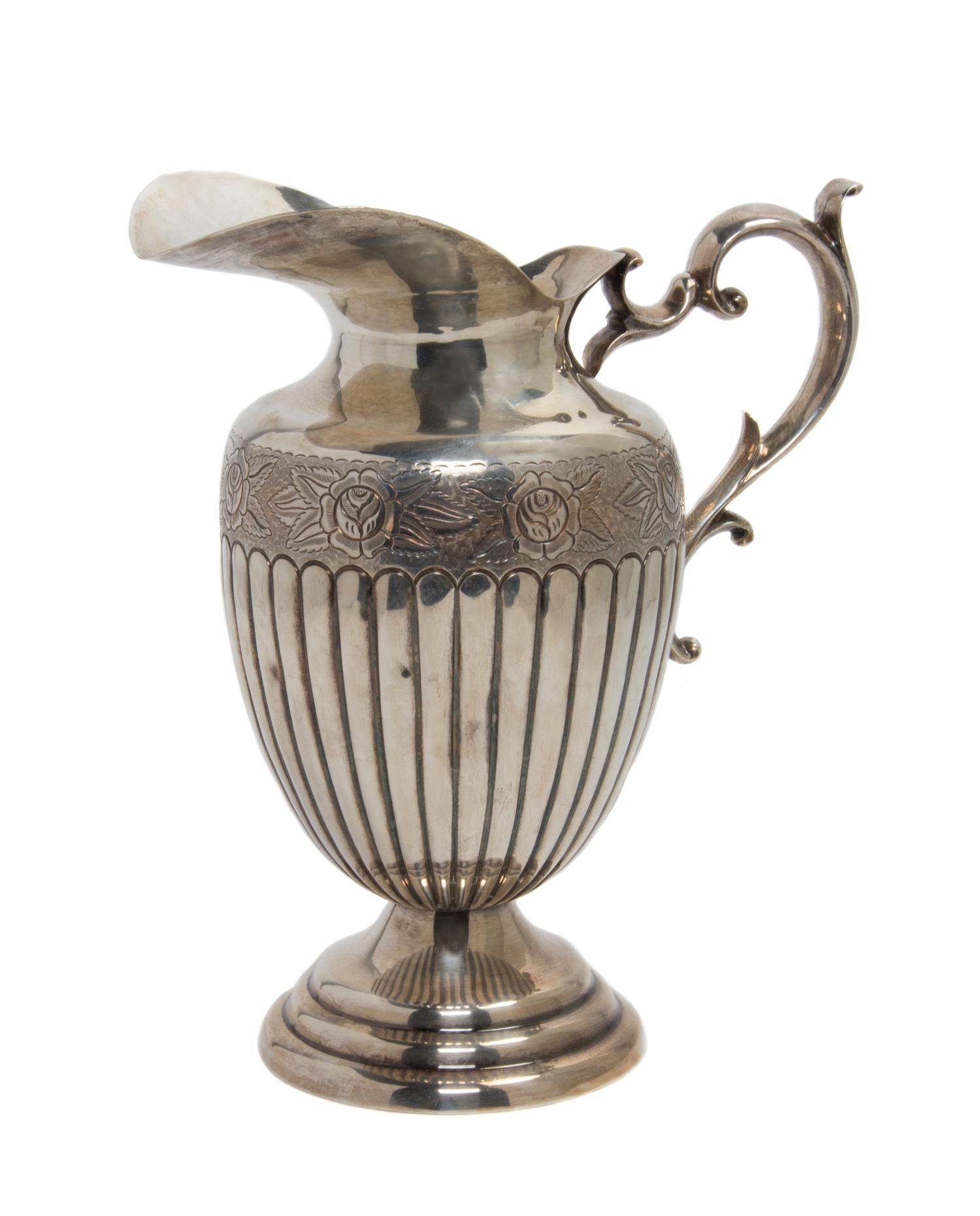 A Mexican Sterling Silver Water Pitcher Height 10 1/2 inches.