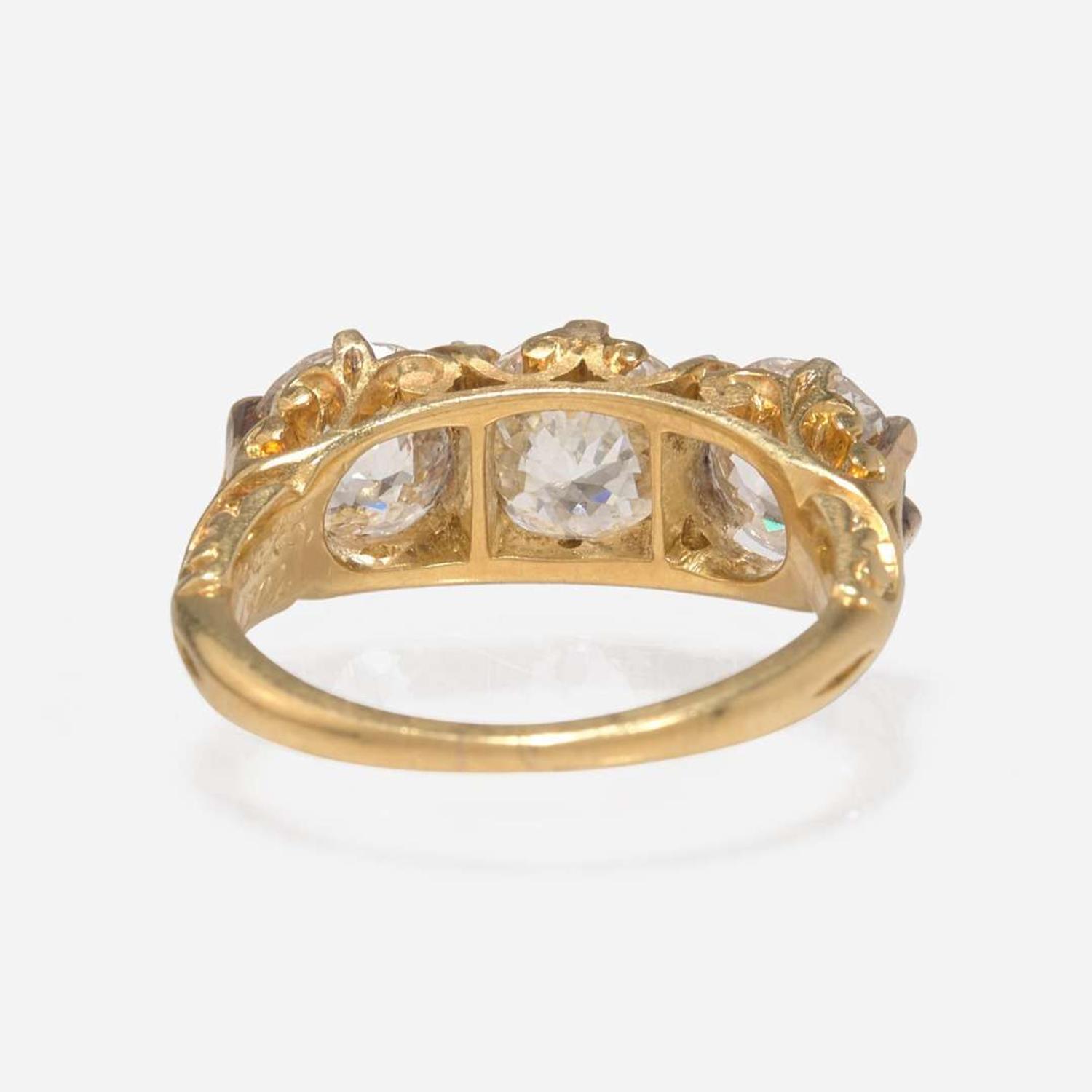 A Three-Stone Diamond and Yellow Gold Ring