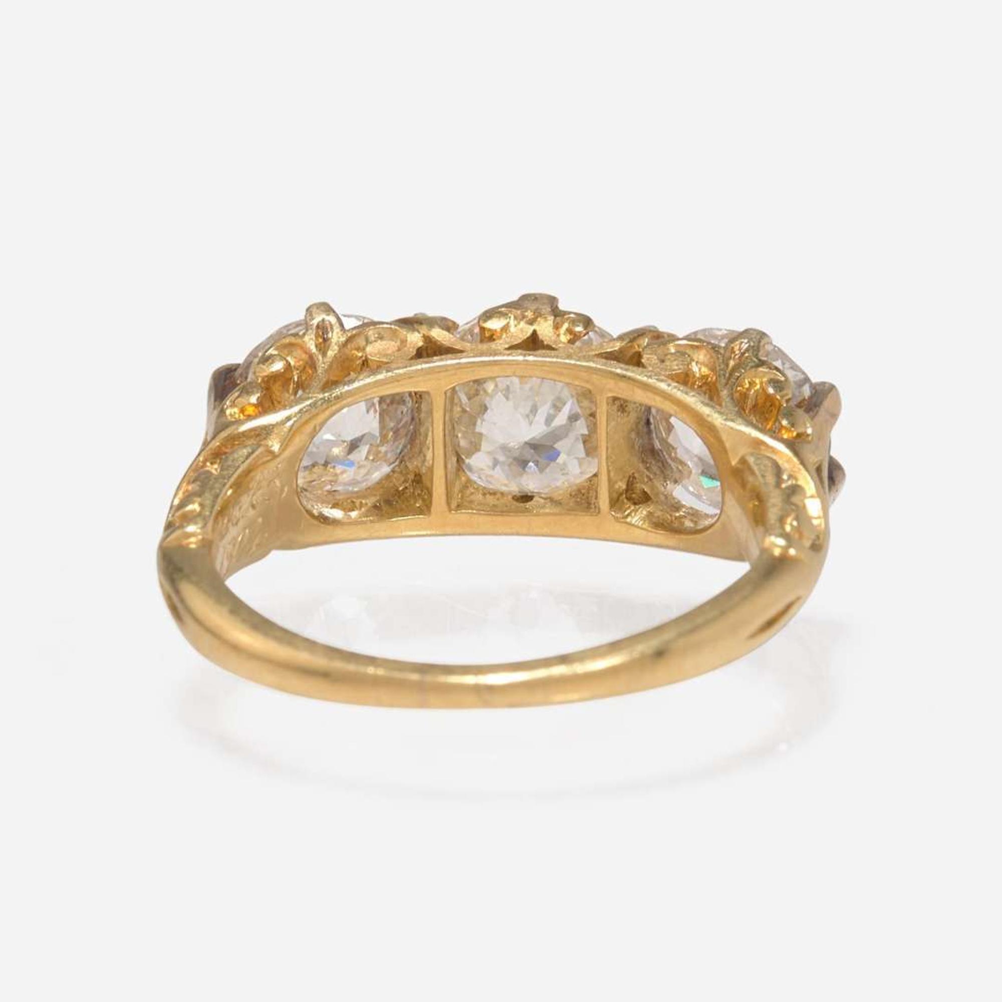 A Three-Stone Diamond and Yellow Gold Ring