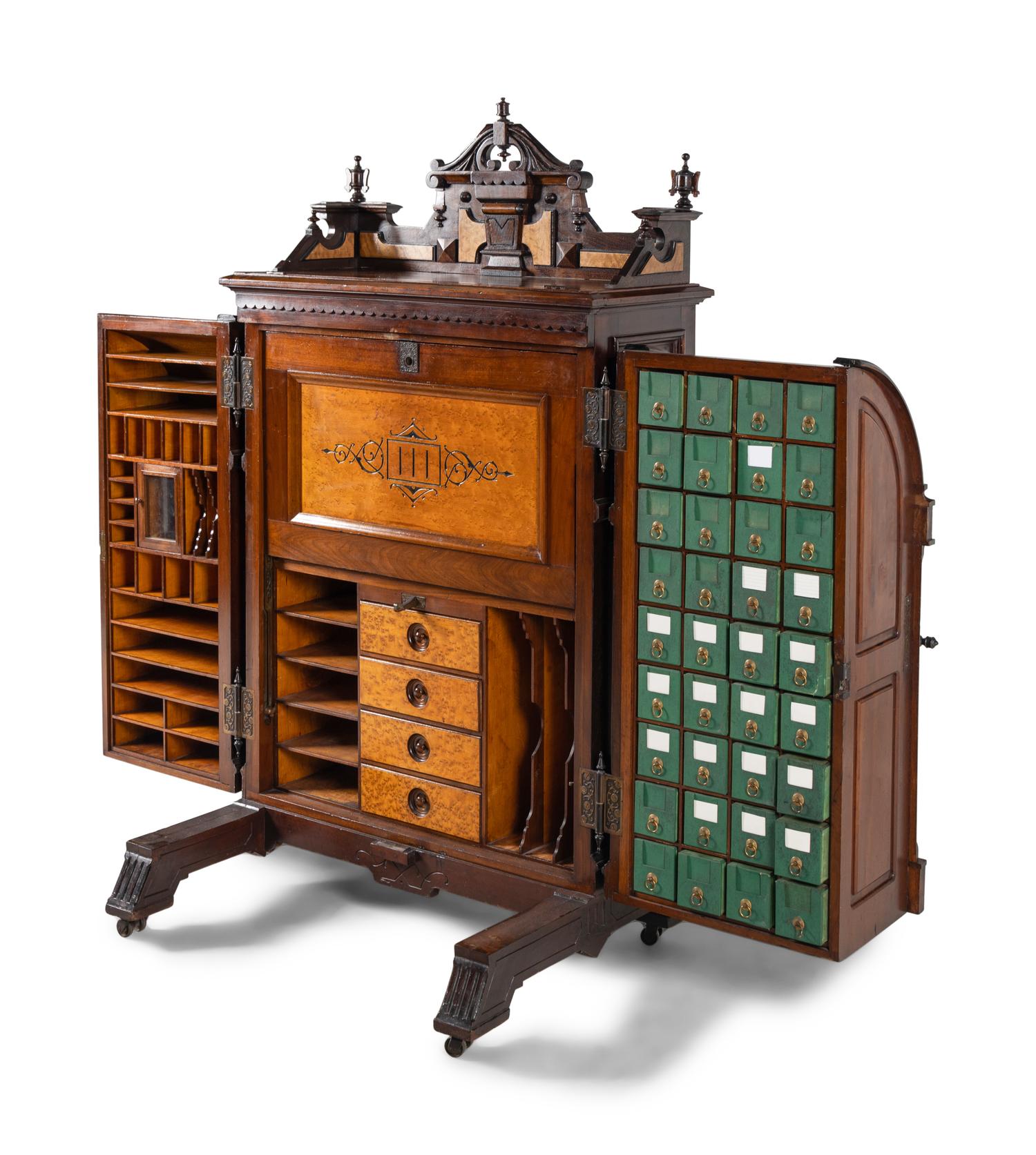 A Victorian Walnut and Bird’s Eye Maple Wooten Patent Desk