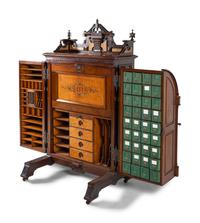 A Victorian Walnut and Bird’s Eye Maple Wooten Patent Desk