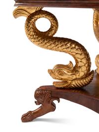 A North European Neoclassical Parcel Gilt Mahogany Center Table