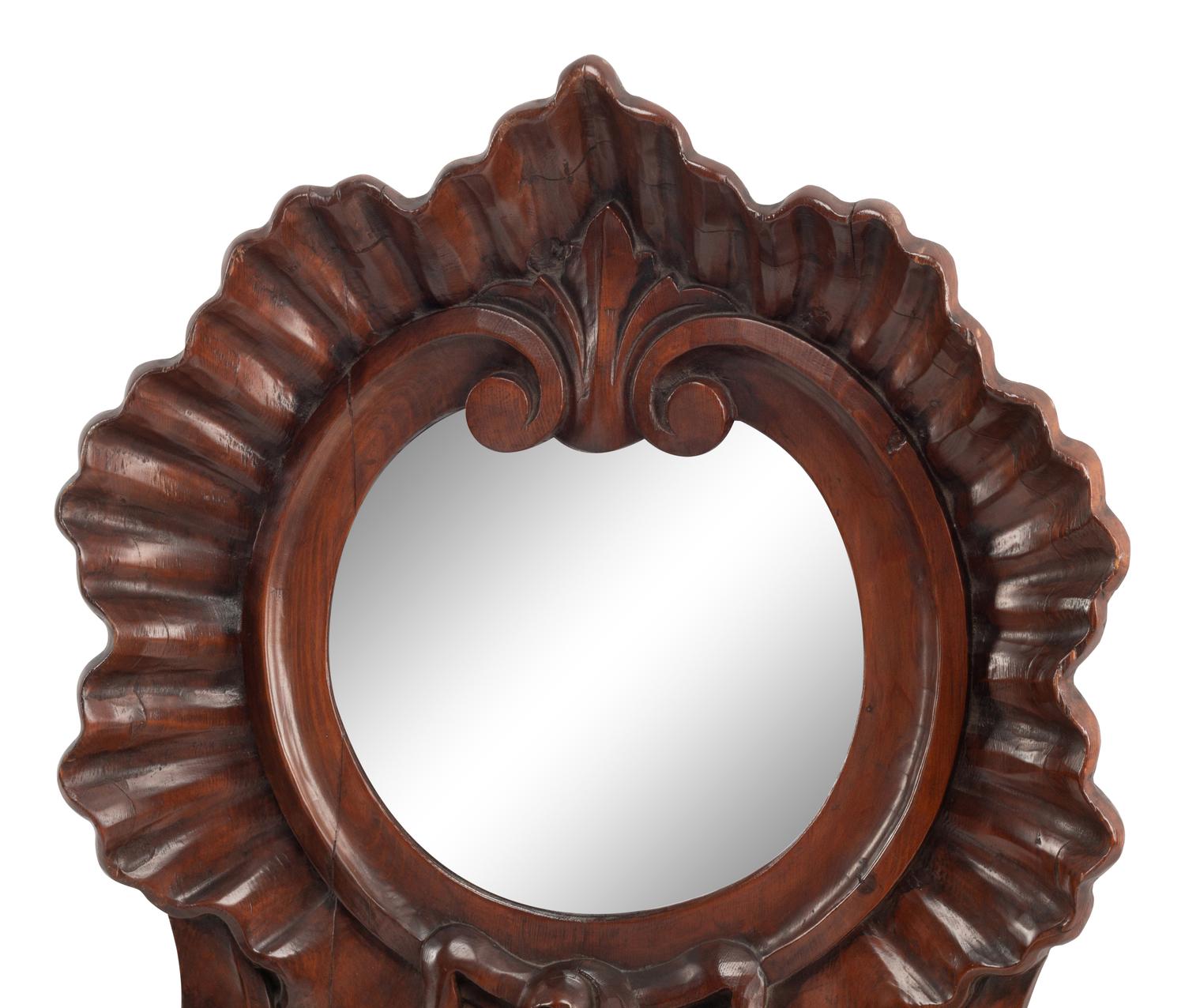 A Continental Carved Walnut Mirror and Wall Pocket