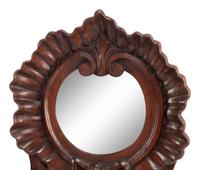 A Continental Carved Walnut Mirror and Wall Pocket