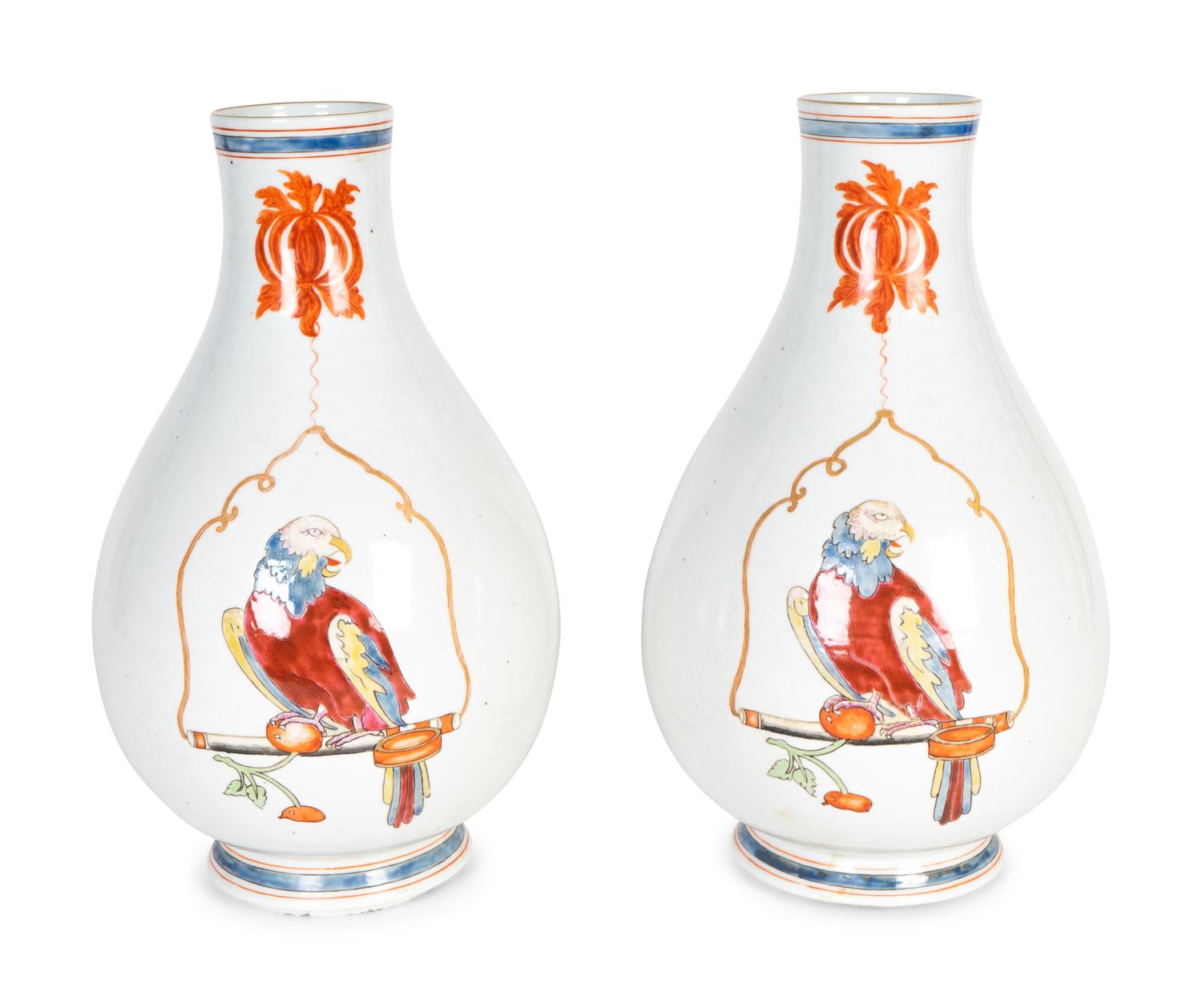 A Pair of Famille Rose Porcelain Parrot on a Perch Vases — AFTER A DESIGN BY CORNELIUS PRONK, 19TH CENTURY