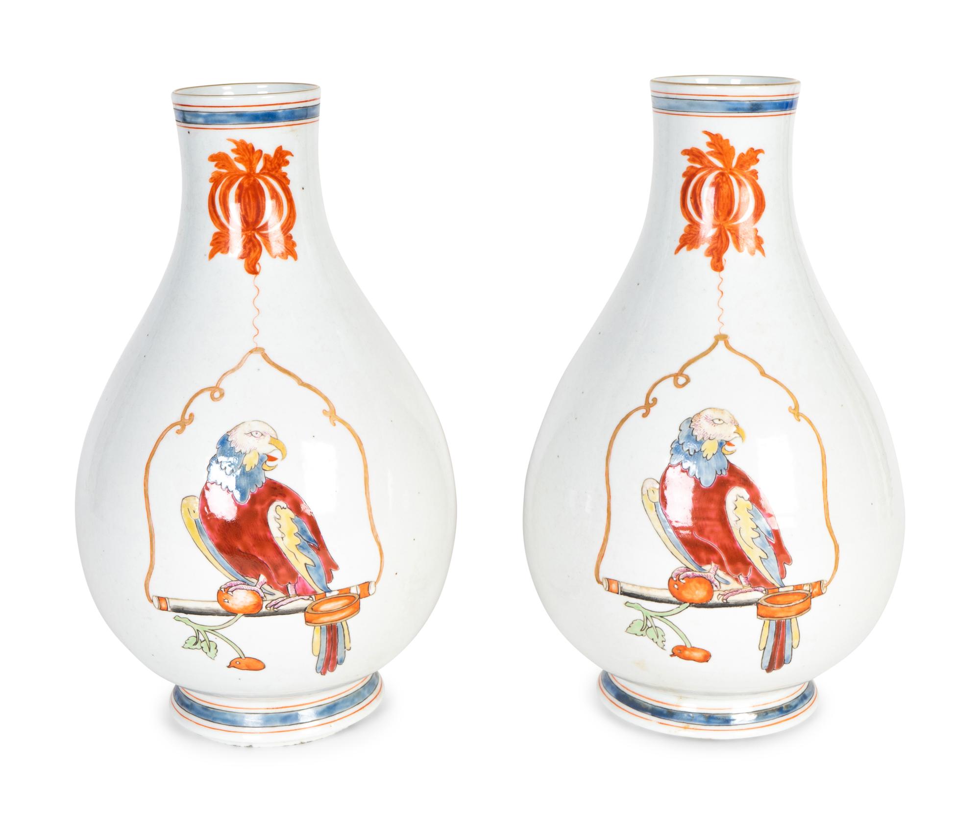 A Pair of Famille Rose Porcelain Parrot on a Perch Vases — AFTER A DESIGN BY CORNELIUS PRONK, 19TH CENTURY