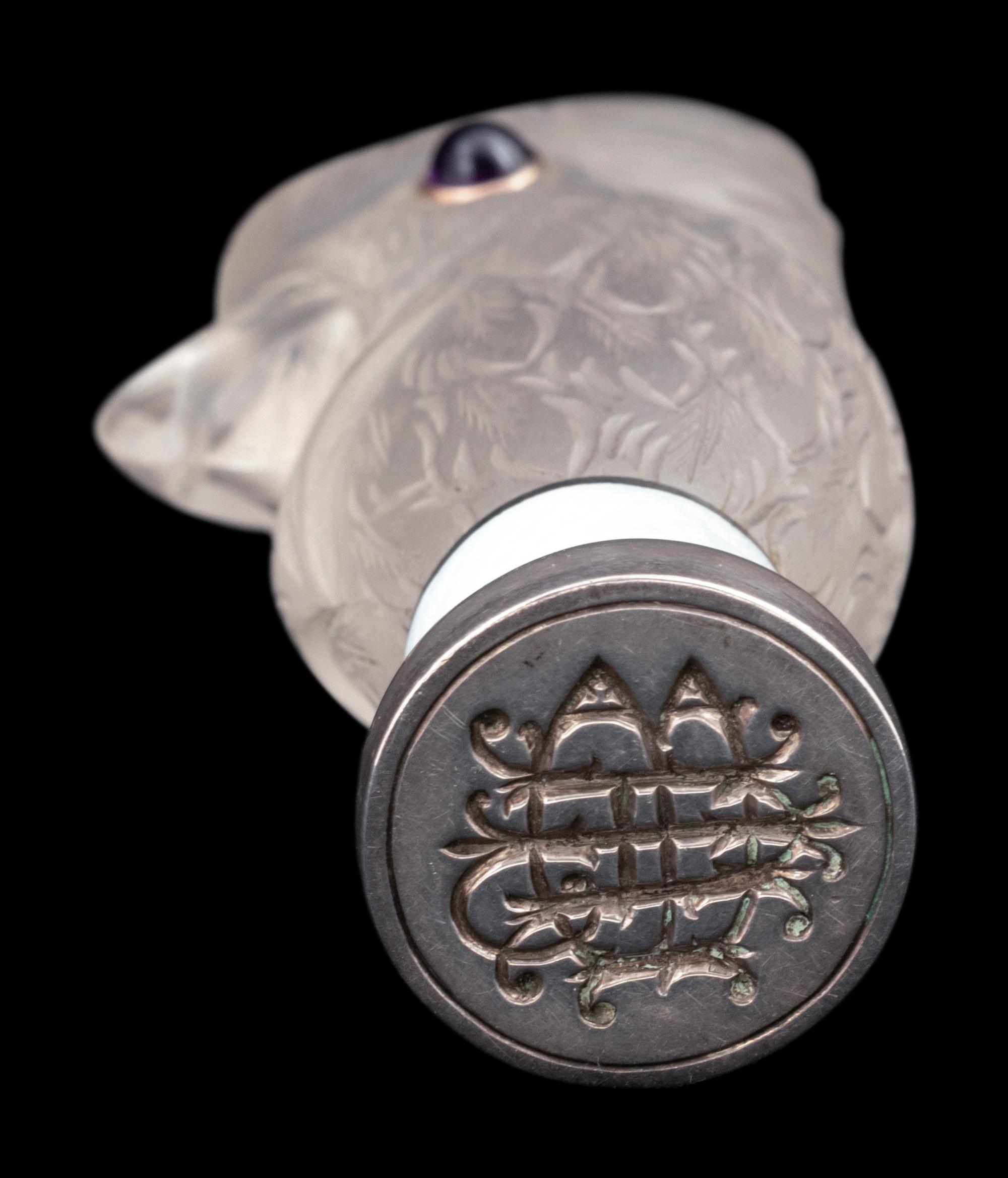 A Continental Carved Rock Crystal and Guilloche Enamel-Mounted Cockatiel-Form Hand Seal