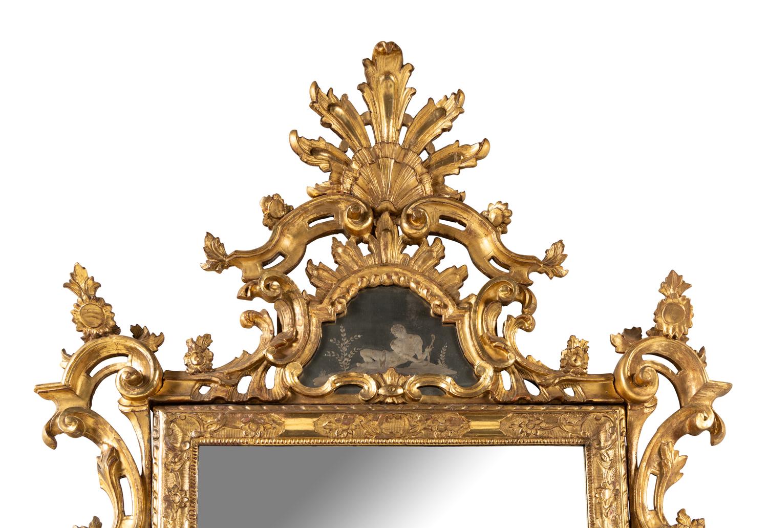 An Italian Baroque Style Giltwood and Etched Glass Mirror