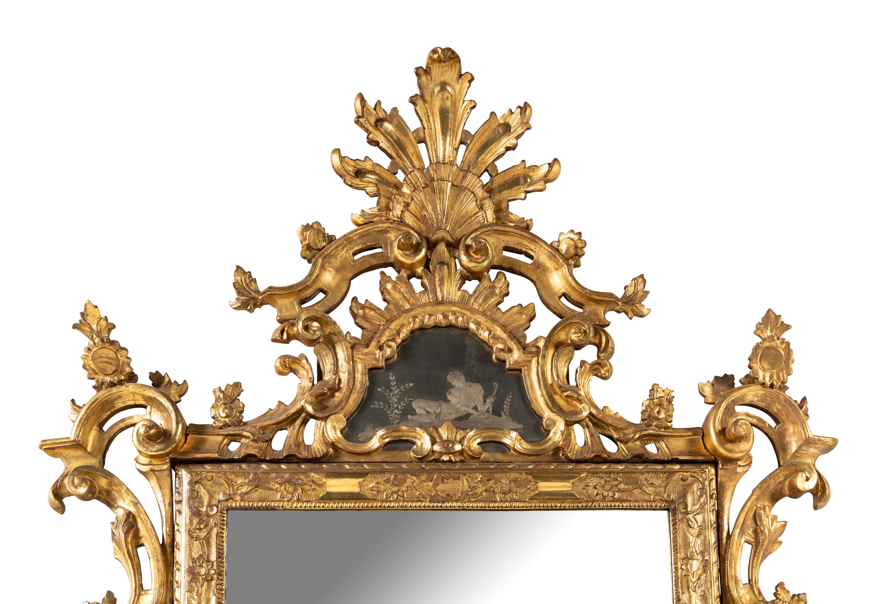 An Italian Baroque Style Giltwood and Etched Glass Mirror