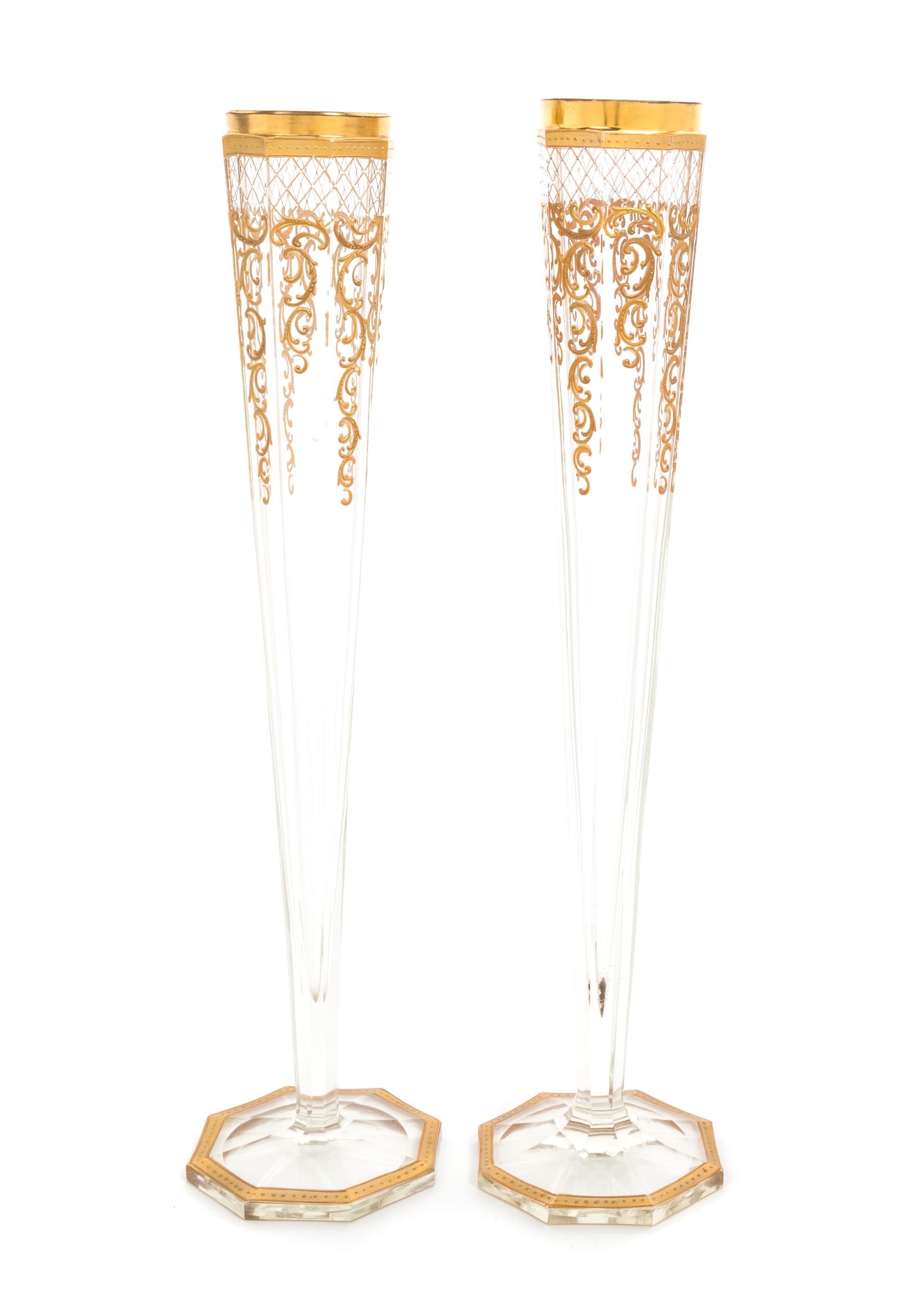 Moser, 19TH/20TH CENTURY, a pair of gilt decorated vases, each of tapering facetted form
