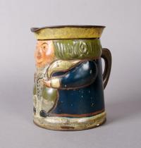 An English Figural Tole Biscuit Tin, Huntley & Palmers, Height 6 3/8 inches.