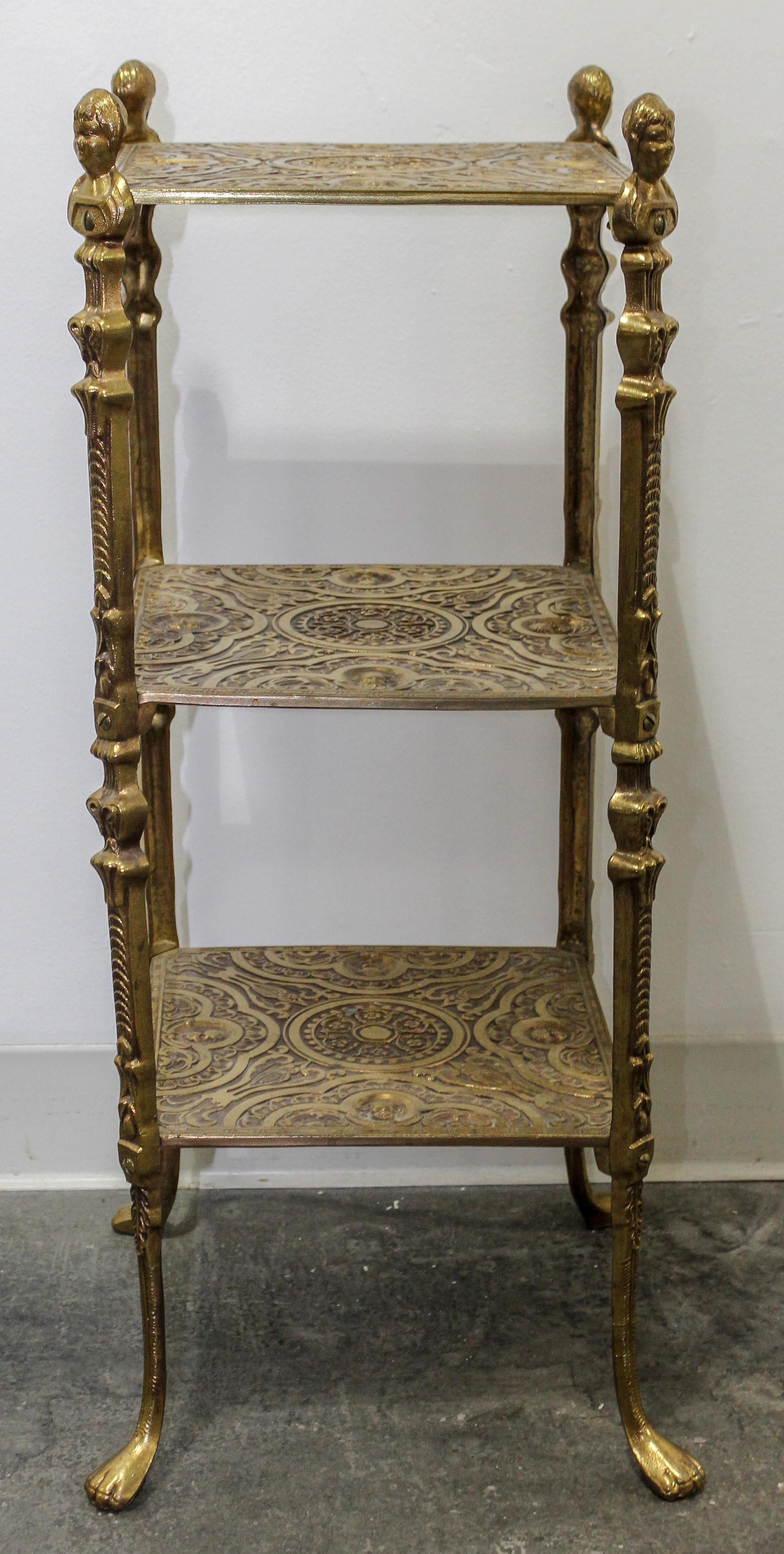 A Brass Etagere Height 29 x width 11 x depth 11 inches.