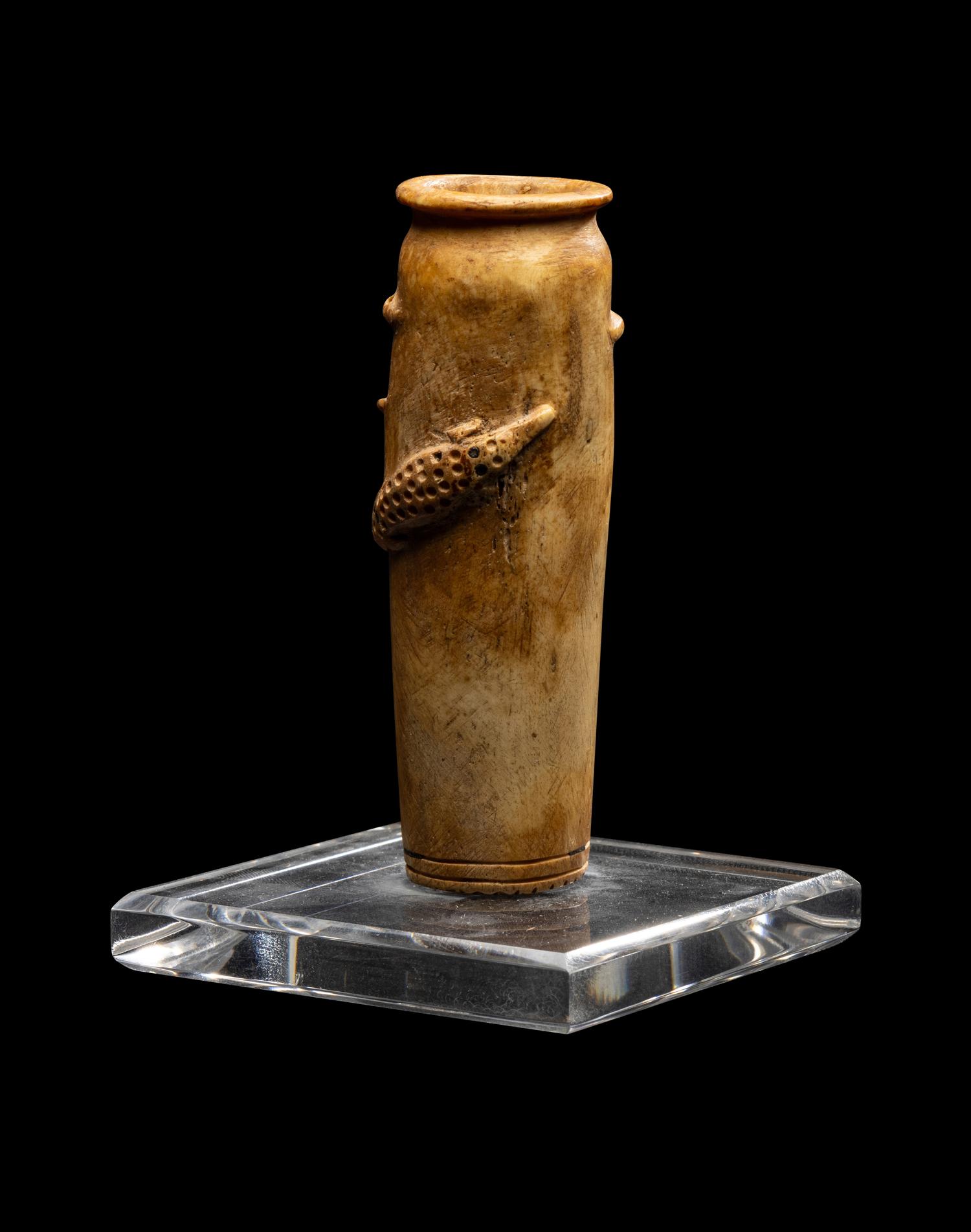 An Egyptian Bone Vase with Crocodiles in Relief