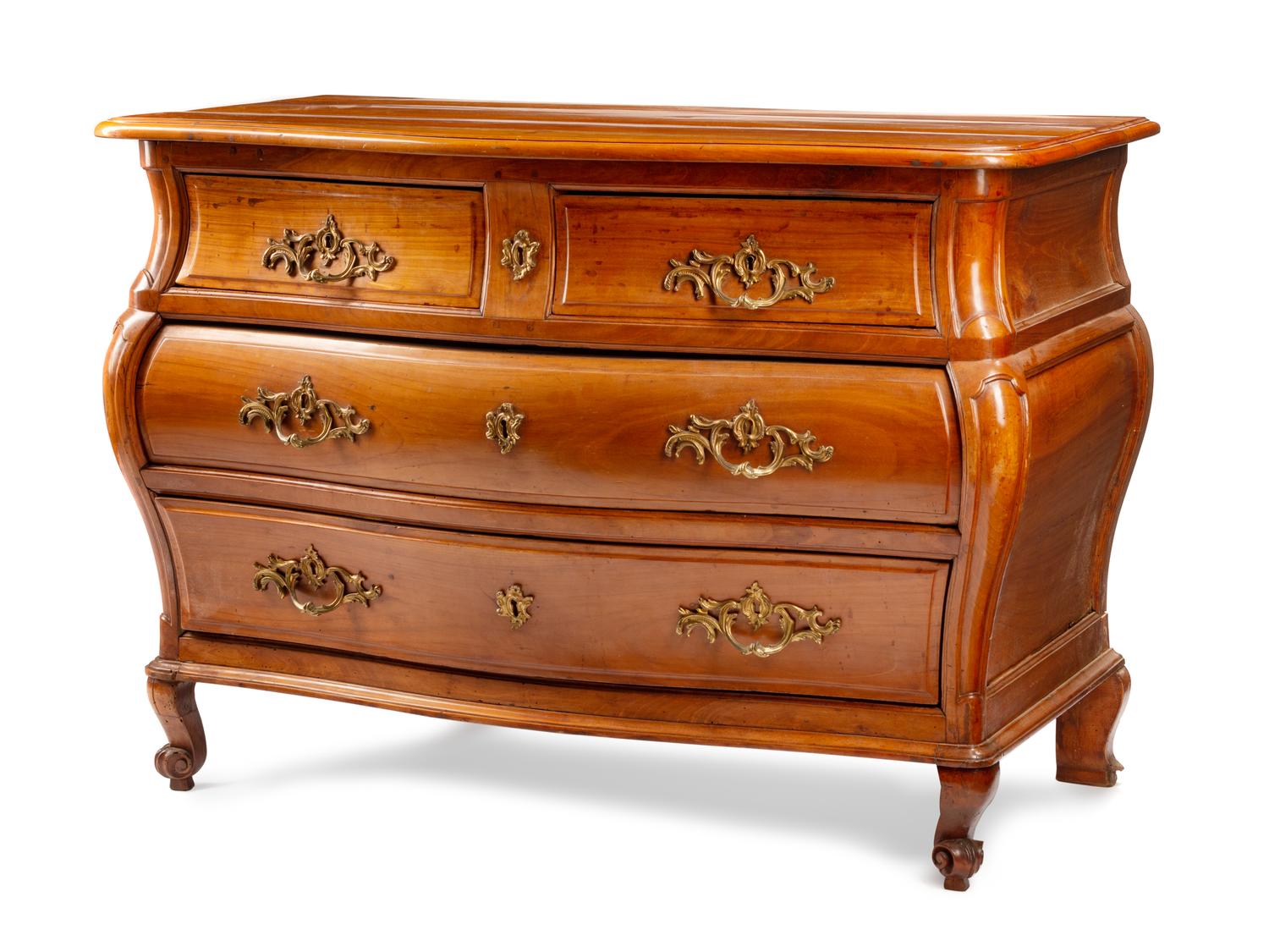 A French Provincial Walnut Bombe Commode