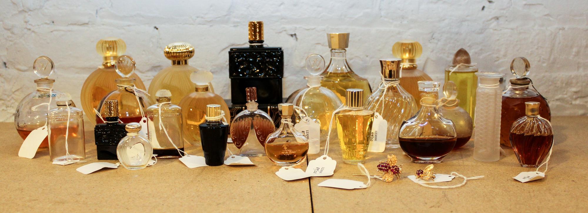 A Collection of Twenty-Six Lalique and Other French Glass Perfume Bottles. Height of tallest 4 3/4 inches.