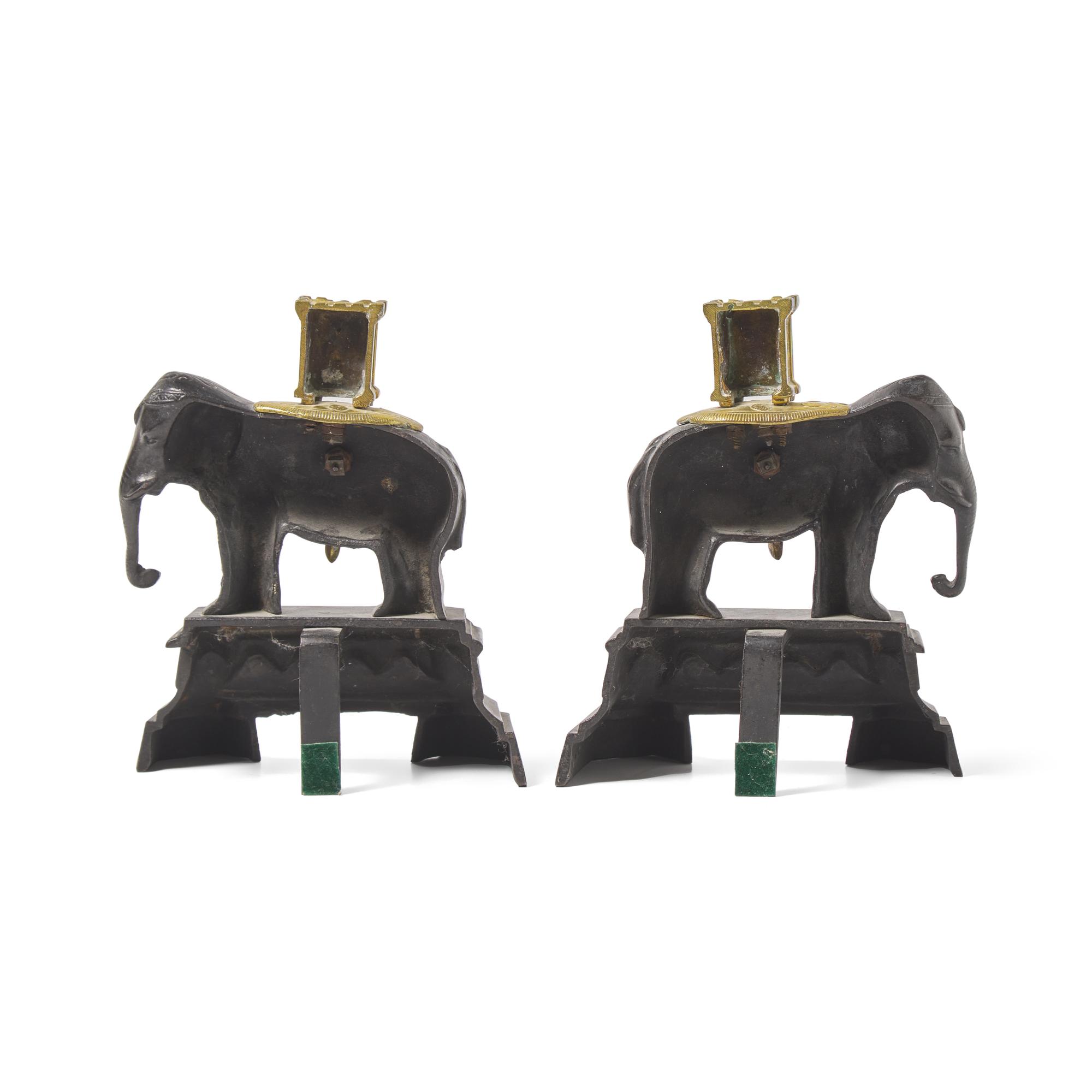 A Pair of French Patinated and Gilt Bronze Elephant-Form Chenets