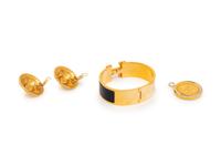 A Group of Three Costume Jewelry Pieces by Hermès and Chanel