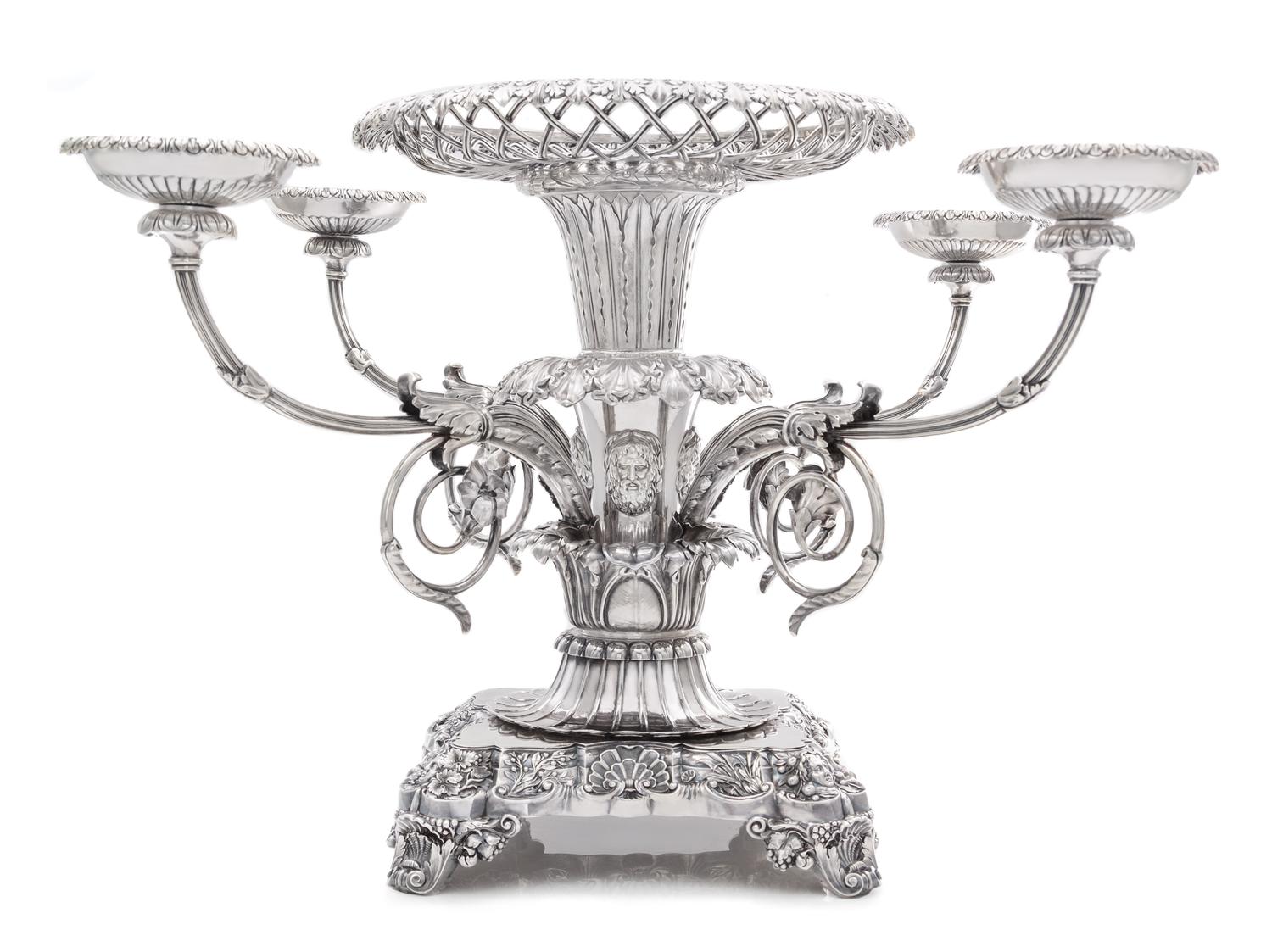 A George III Silver Epergne, Paul Storr, London, 1814, the foliate rim above an openwork basket and acanthus and mask decorated stem is