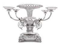 A George III Silver Epergne, Paul Storr, London, 1814, the foliate rim above an openwork basket and acanthus and mask decorated stem is