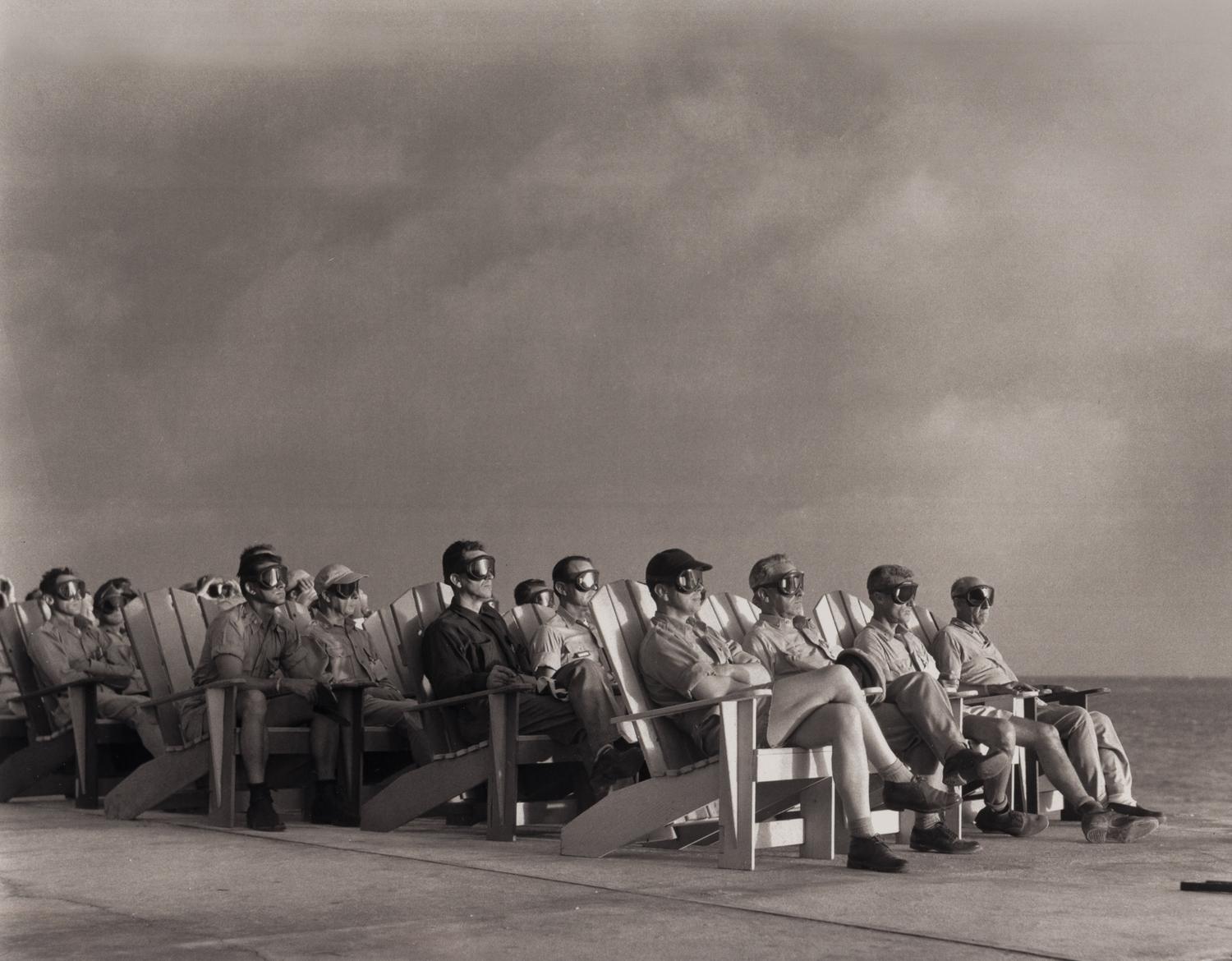 [OPERATION GREENHOUSE - DOG TEST]. Photograph of VIP observers lit up by the light of an atomic bomb on Enewetak Atoll 1951 (but printed 2009).