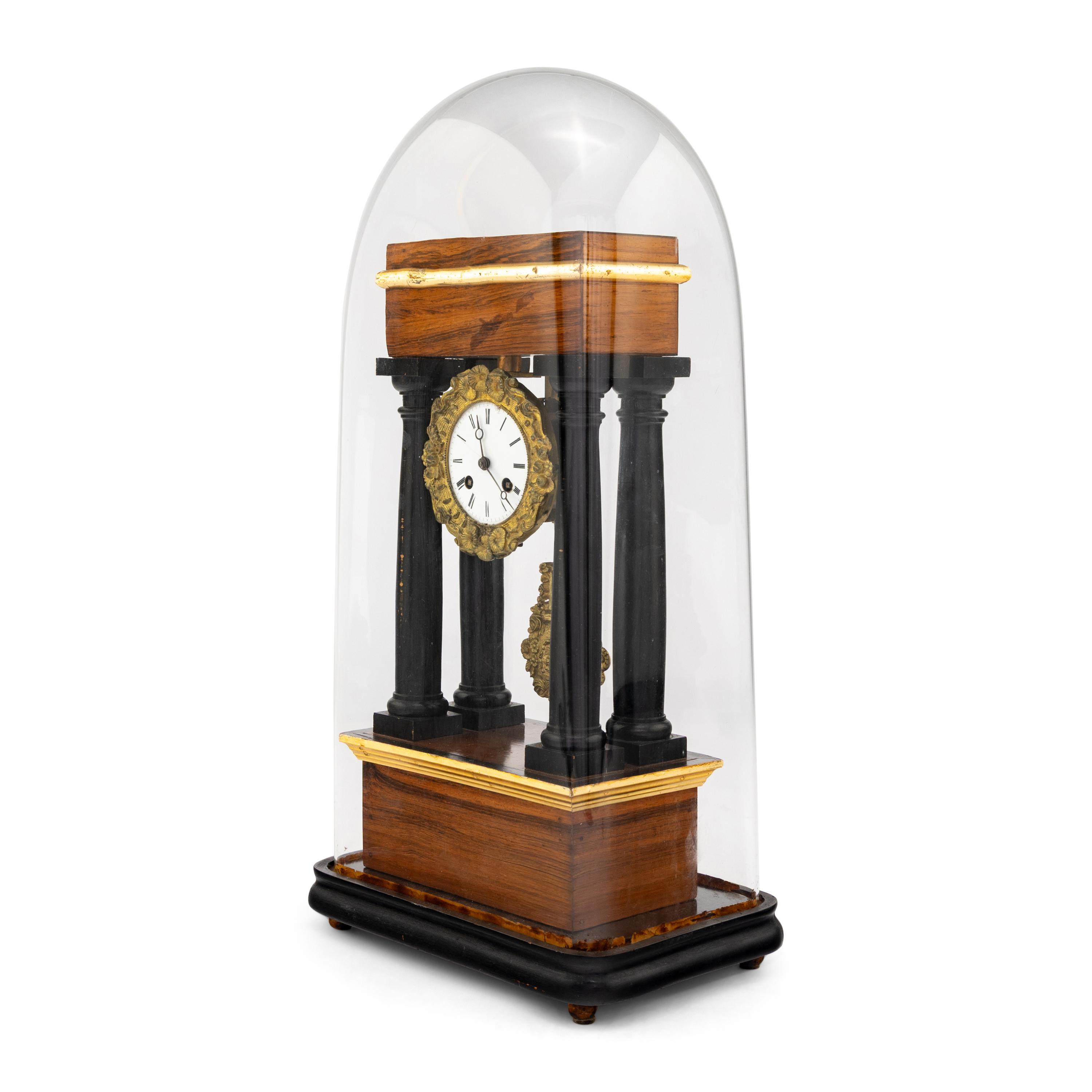 A French Rosewood and Part Ebonized Mantel Clock