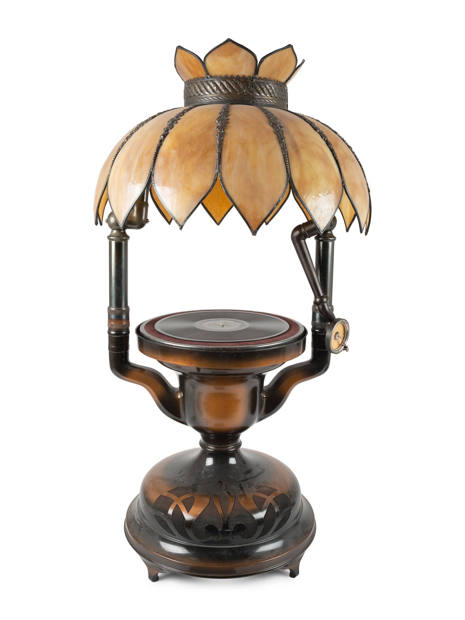 A Fairy Phonograph Patinated Metal Lamp with a Slag Glass Shade