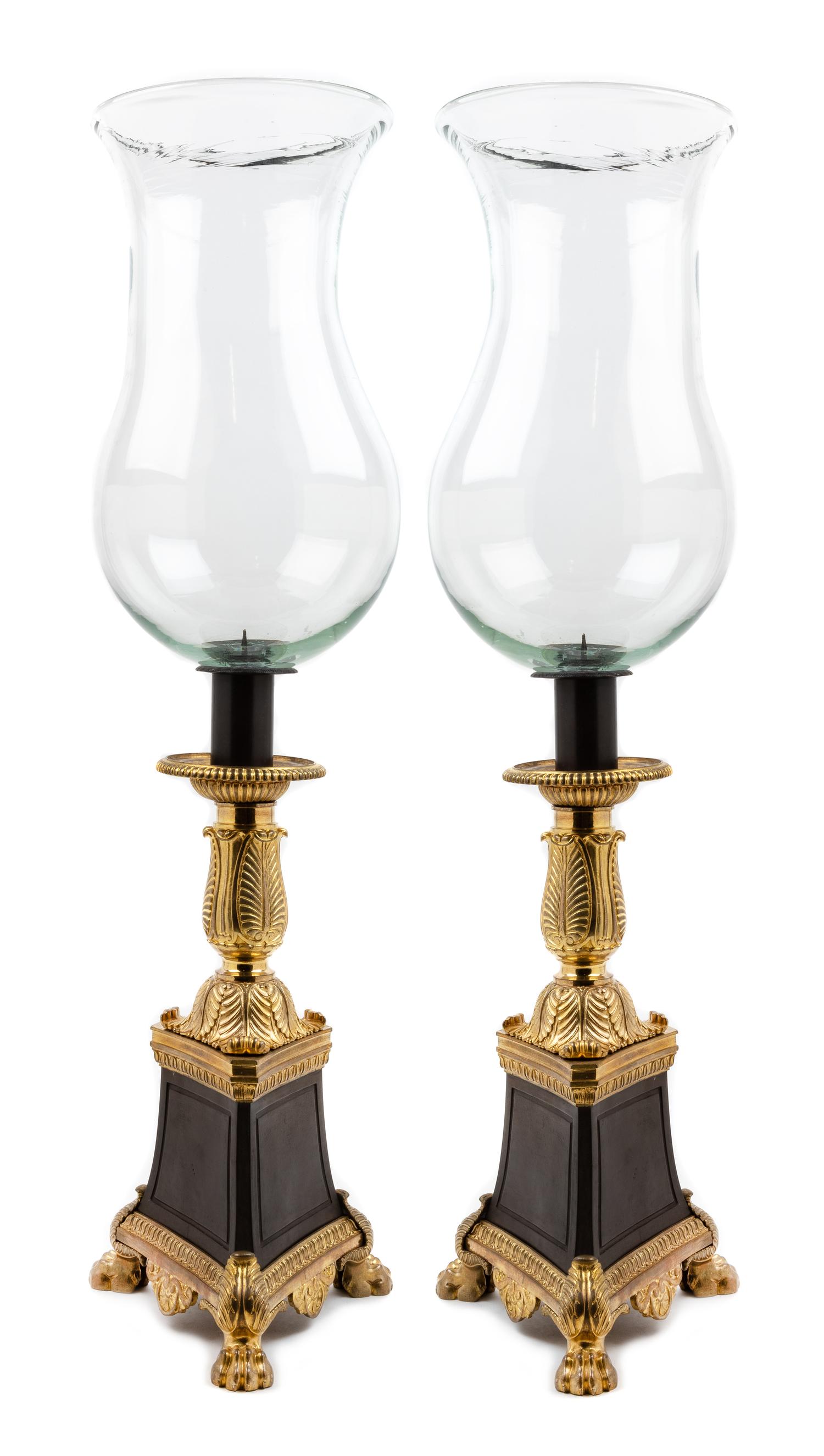 A Pair of Empire Style Gilt and Patinated Bronze Hurricane Candlesticks