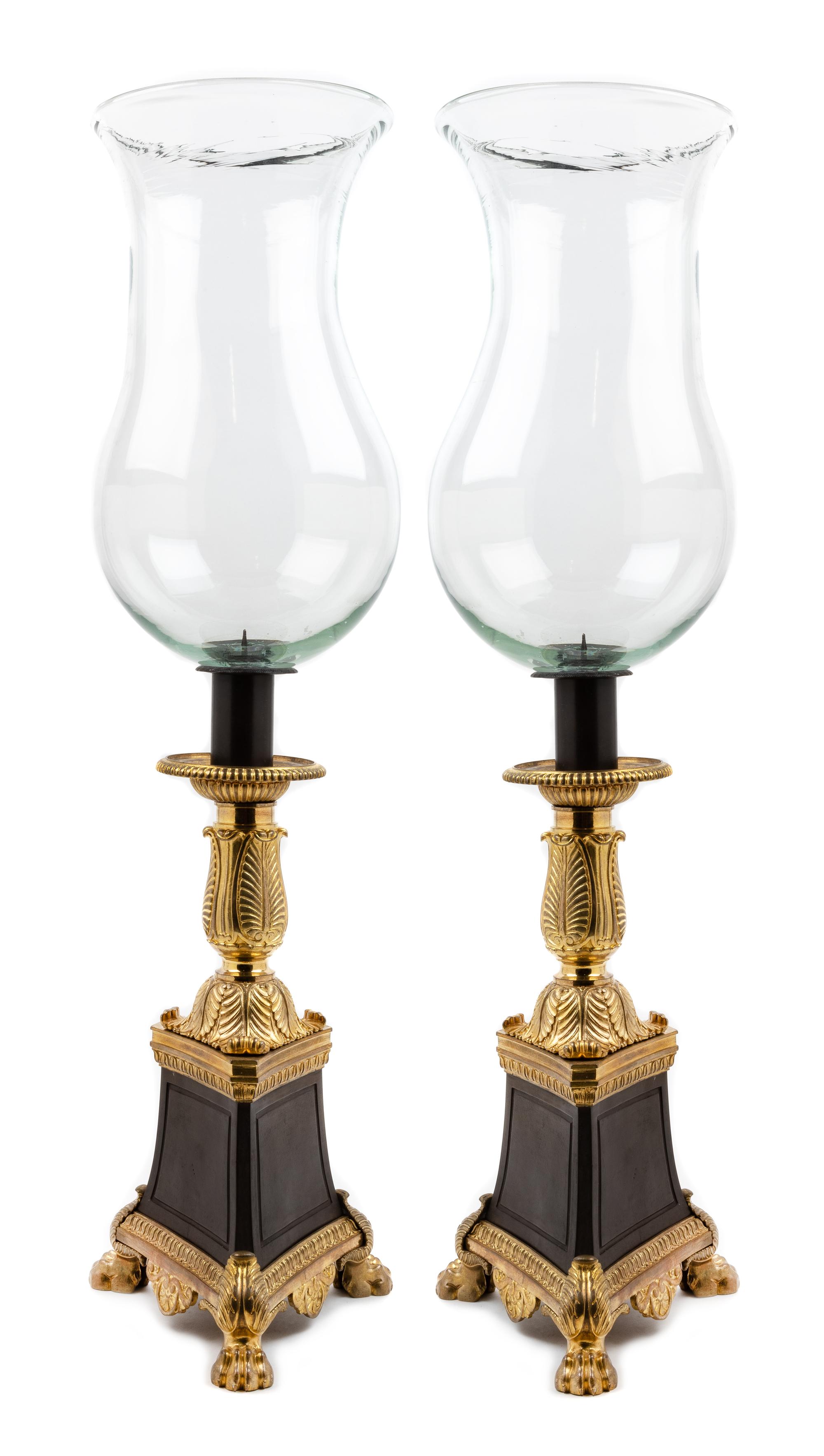 A Pair of Empire Style Gilt and Patinated Bronze Hurricane Candlesticks