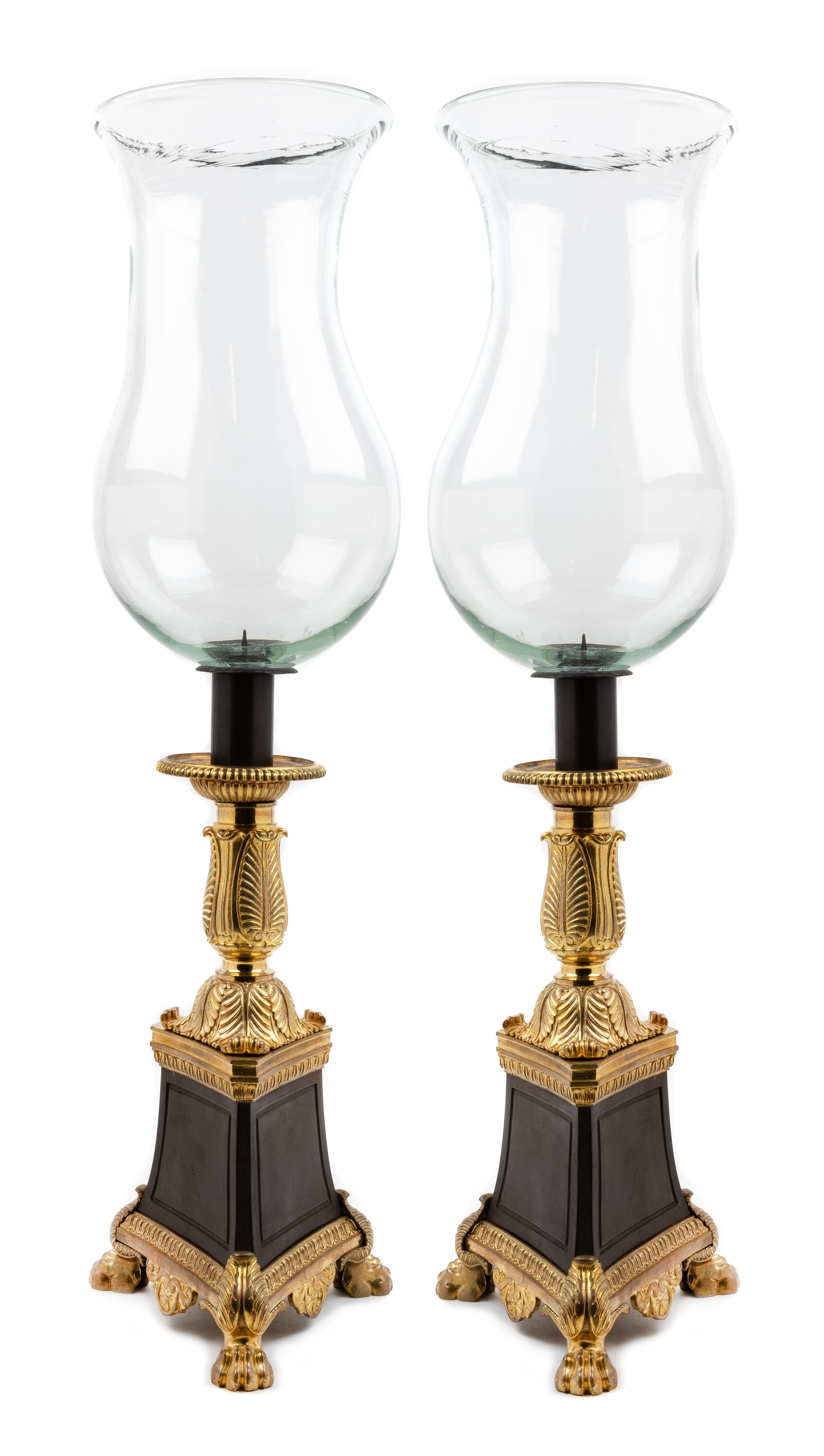A Pair of Empire Style Gilt and Patinated Bronze Hurricane Candlesticks