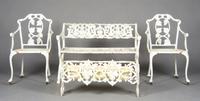 An Assembled Suite of Cast Iron Garden Furniture, Width of first 43 inches.
