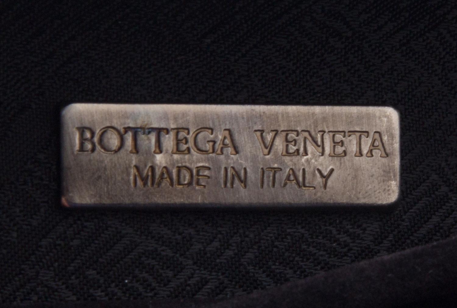 A Bottega Veneta Grey Intrecciato Leather Clutch, 6.5" x 4" x 2".