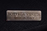 A Bottega Veneta Grey Intrecciato Leather Clutch, 6.5" x 4" x 2".