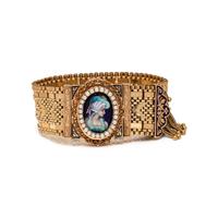 YELLOW GOLD, ENAMEL, AND SEED PEARL SURPRISE WATCH