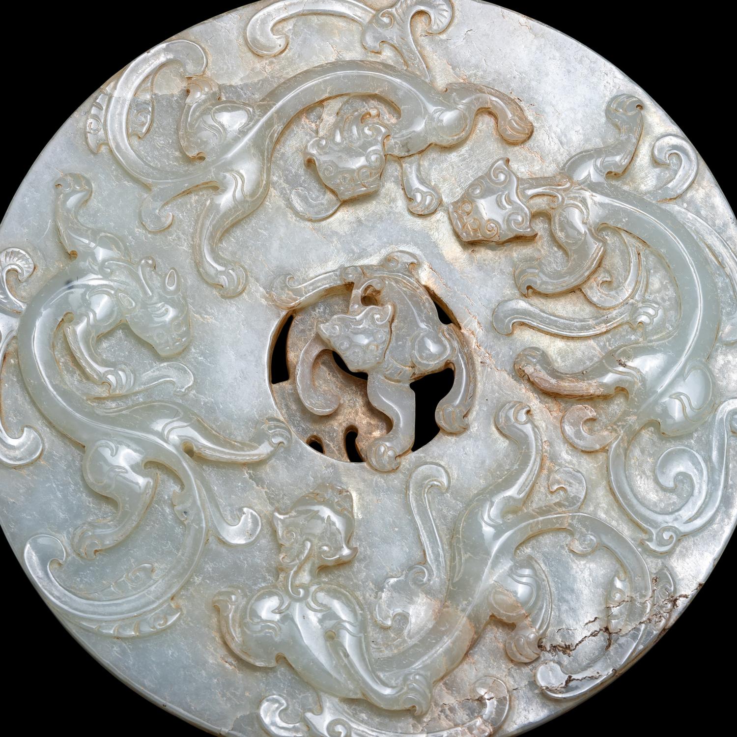 A Chinese Pale Celadon Jade 'Chilong' Bi Disk 青玉螭龍紋璧